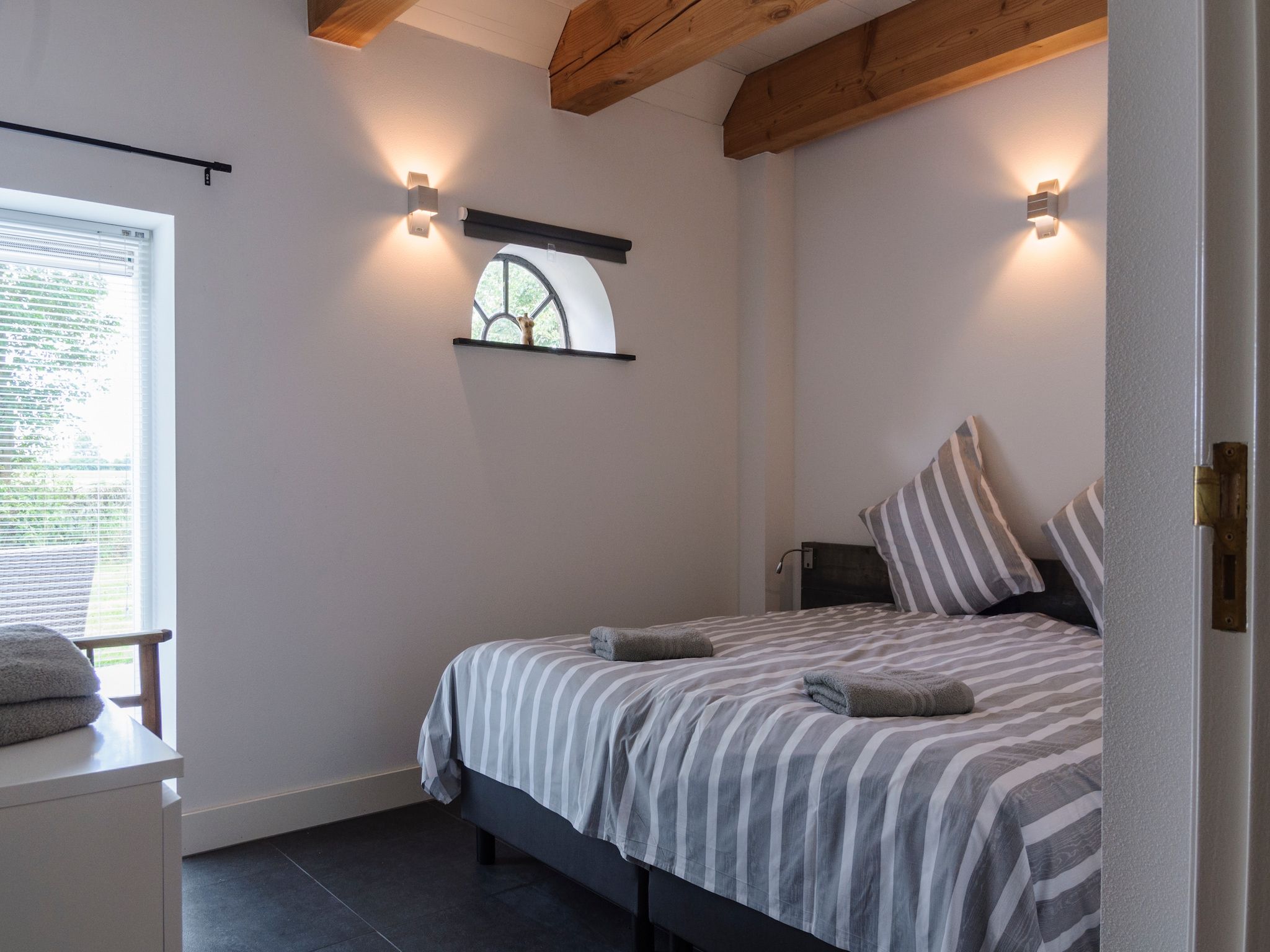 Een slaapkamer van Groepsaccomodatie - Balkenhoeve in Schagen