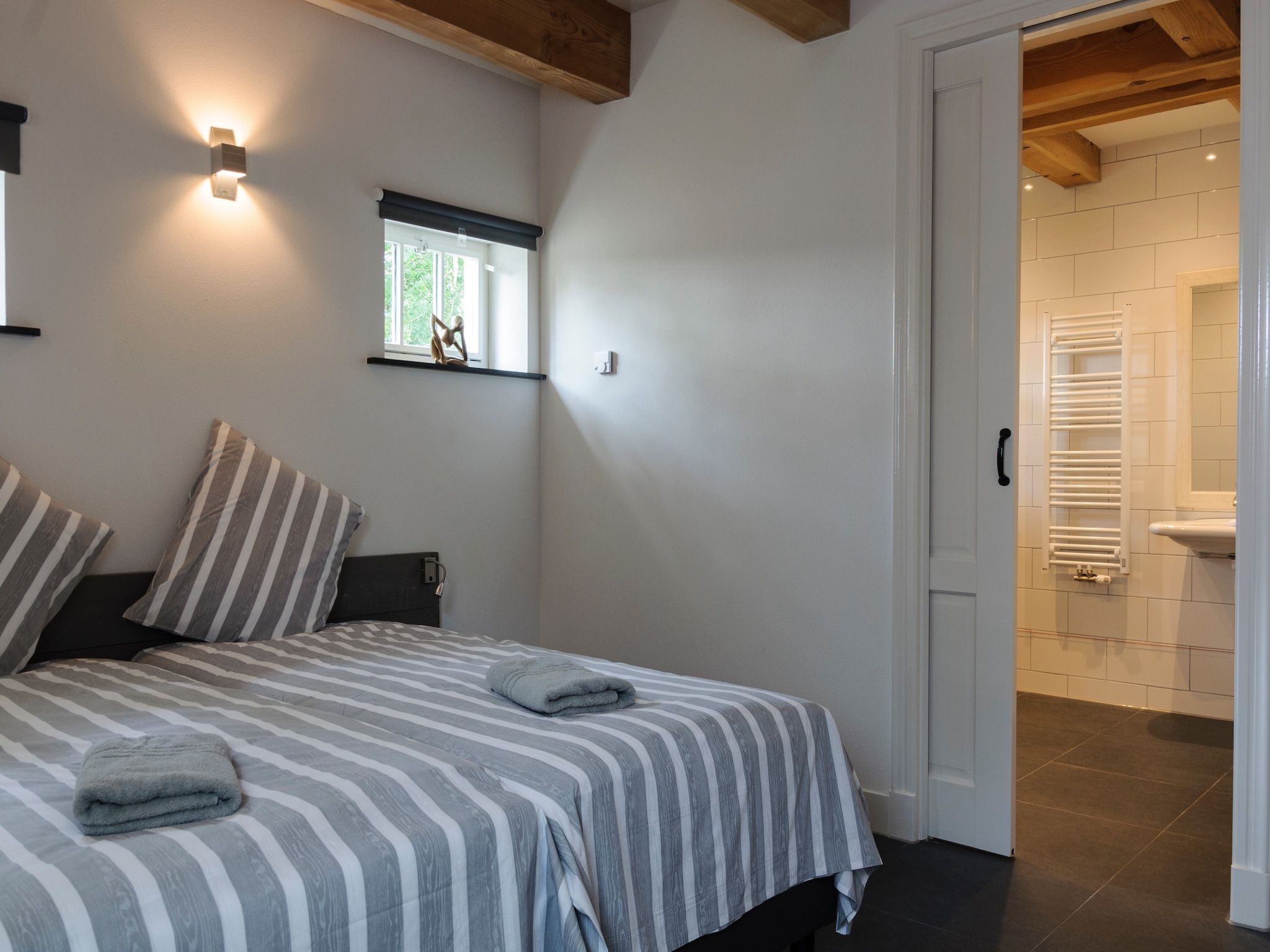 Een slaapkamer van Groepsaccomodatie - Balkenhoeve in Schagen