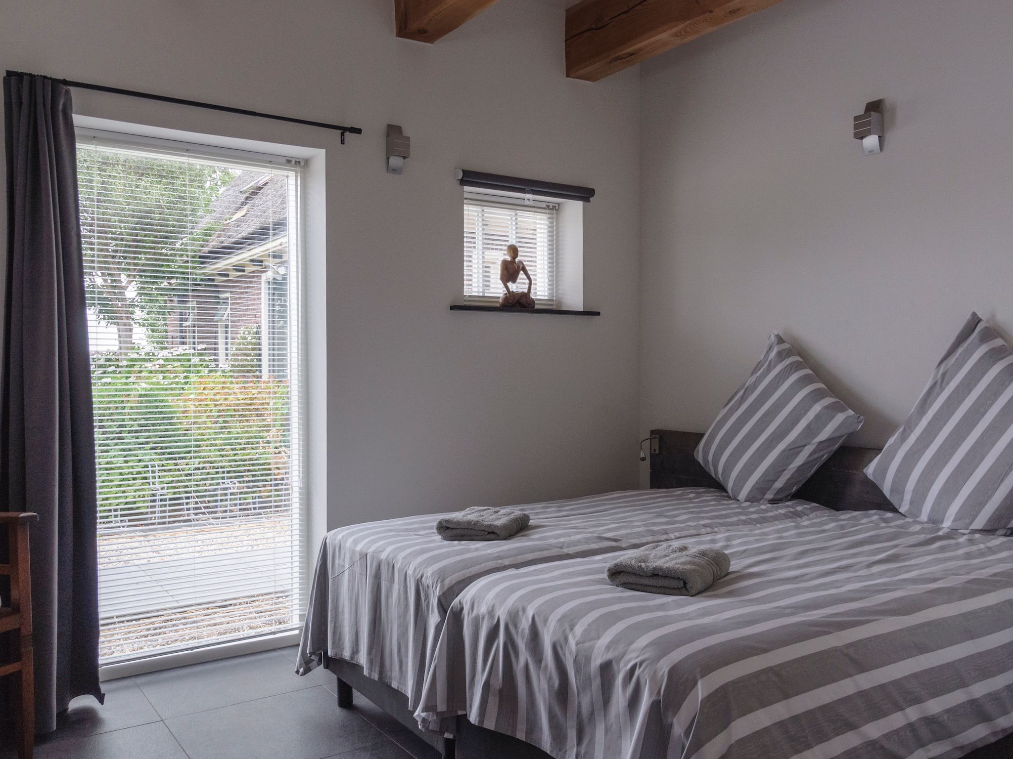 Een slaapkamer van Groepsaccomodatie - Balkenhoeve in Schagen