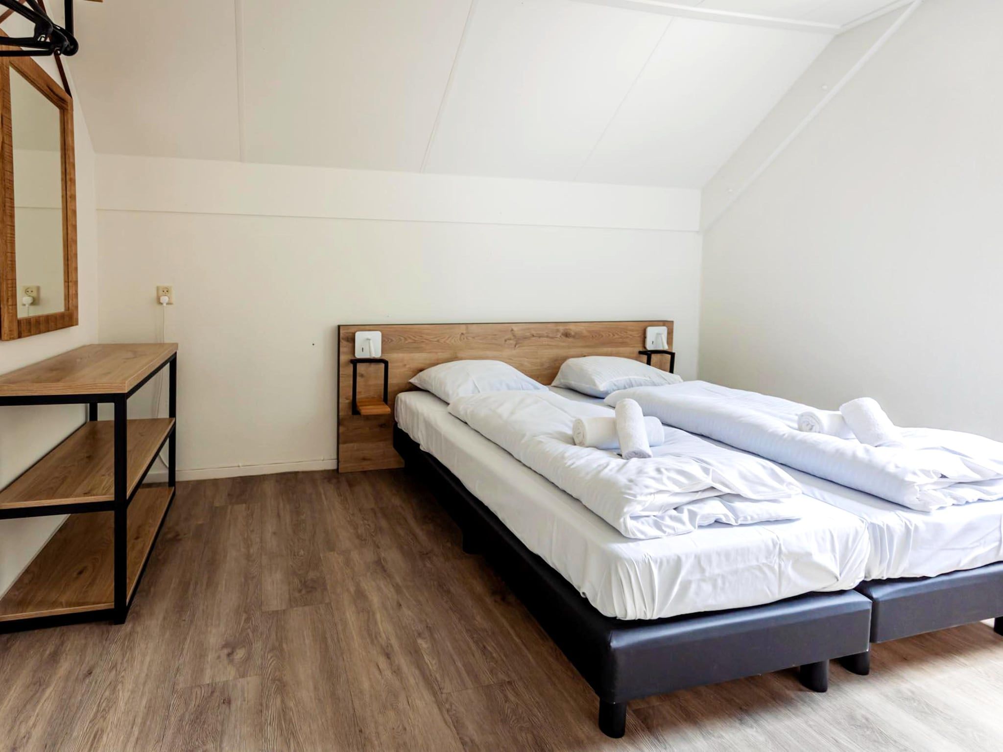 Een slaapkamer van 8 - Persons Family bungalow in Ewijk