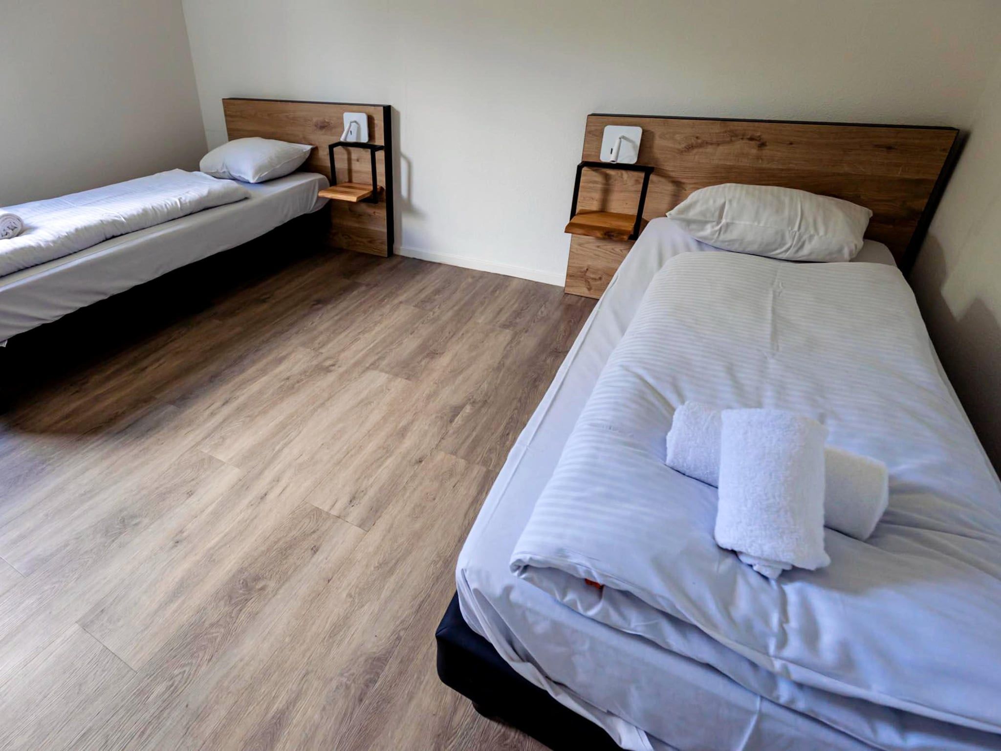 Een slaapkamer van 8 - Persons Family bungalow in Ewijk