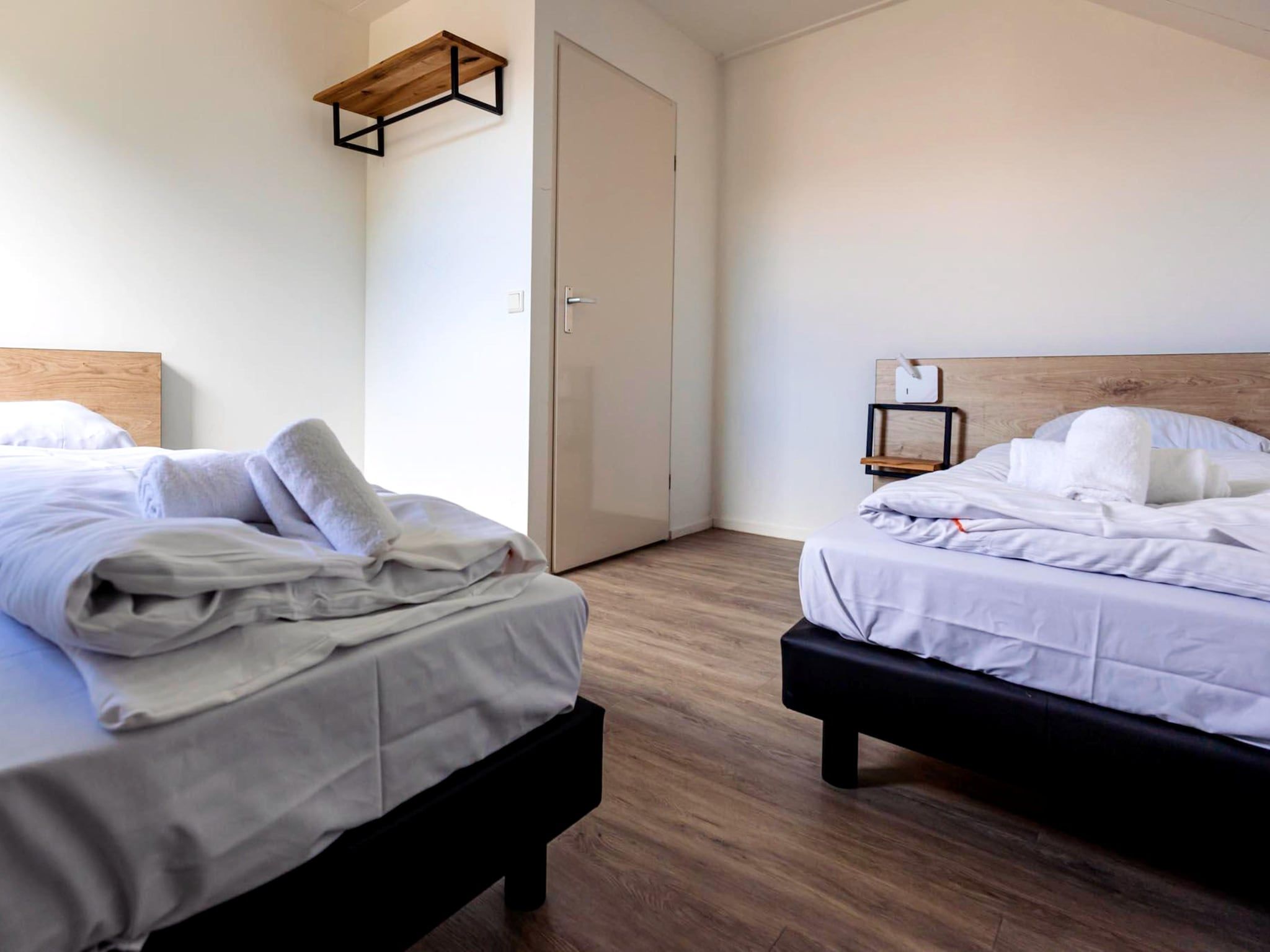 Een slaapkamer van 8 - Persons Family bungalow in Ewijk