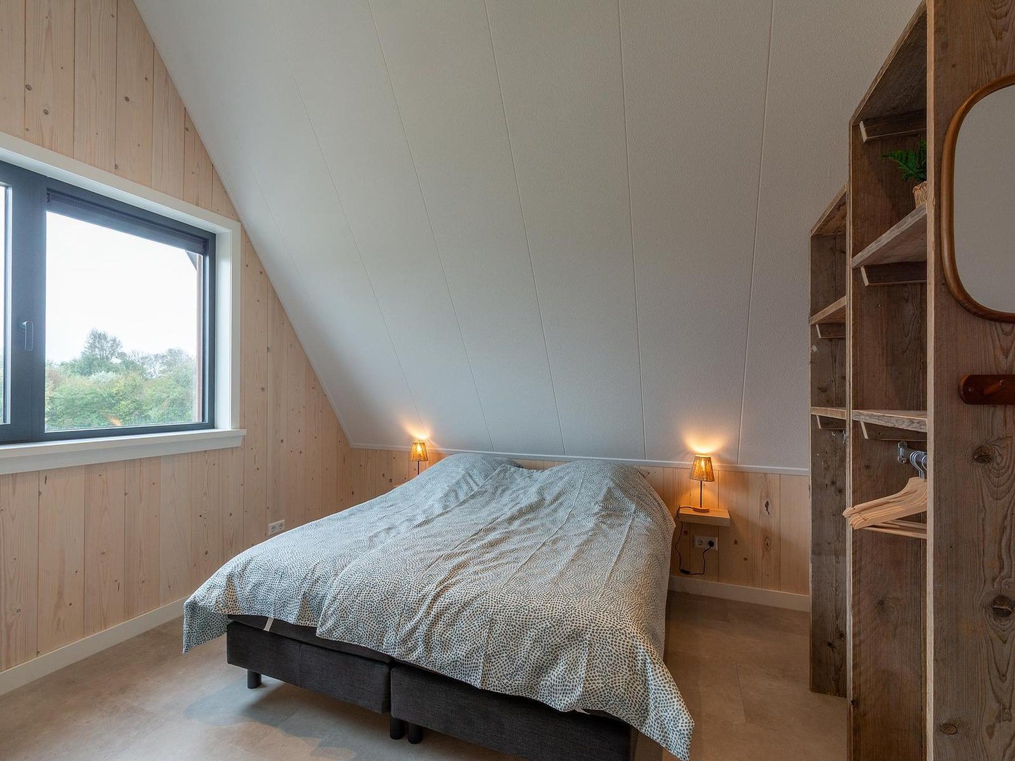 Een slaapkamer van Sandepark 113 in Groote Keeten