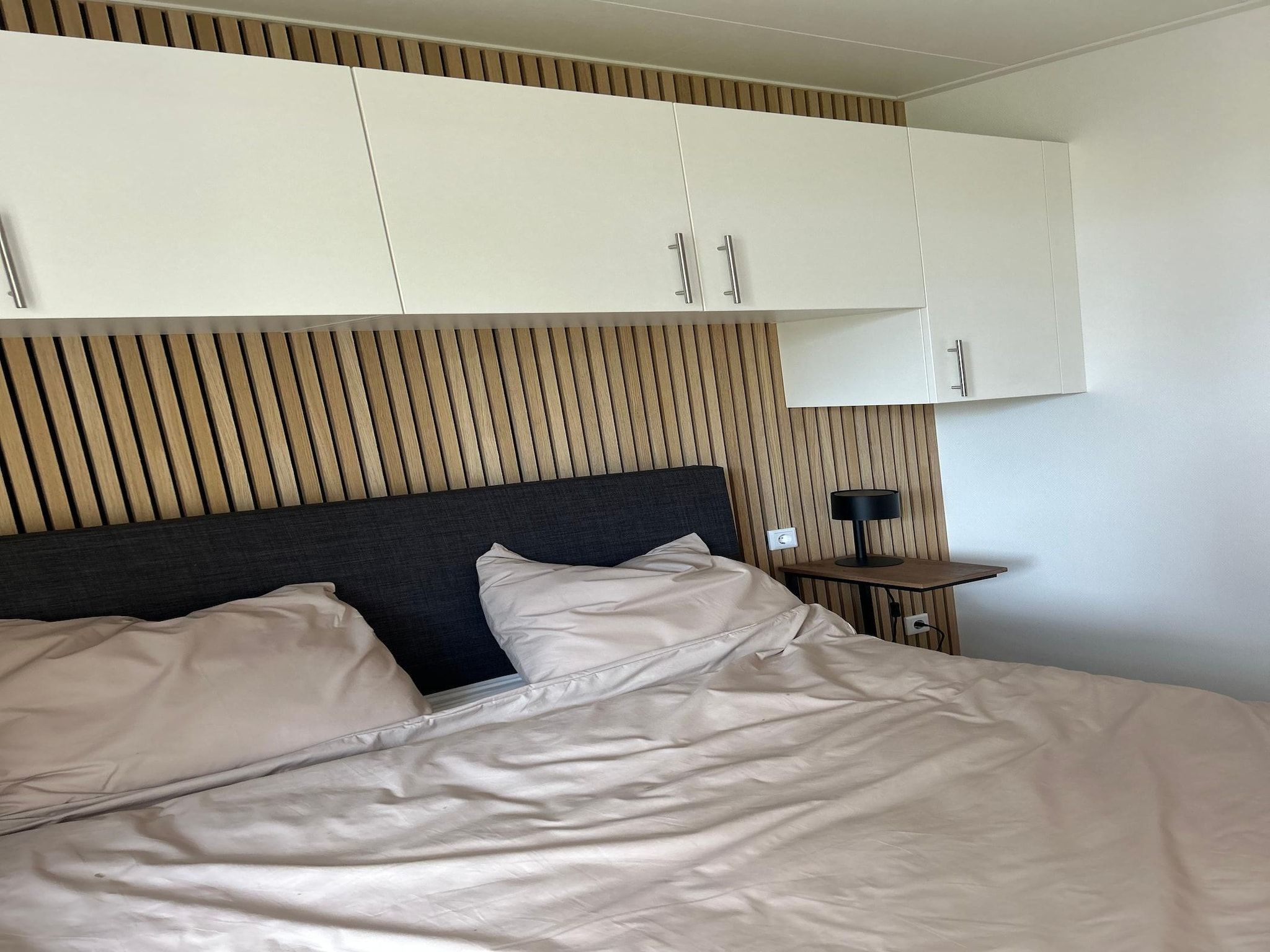 Een slaapkamer van De Steppe 8 pax - 5 in Ulicoten