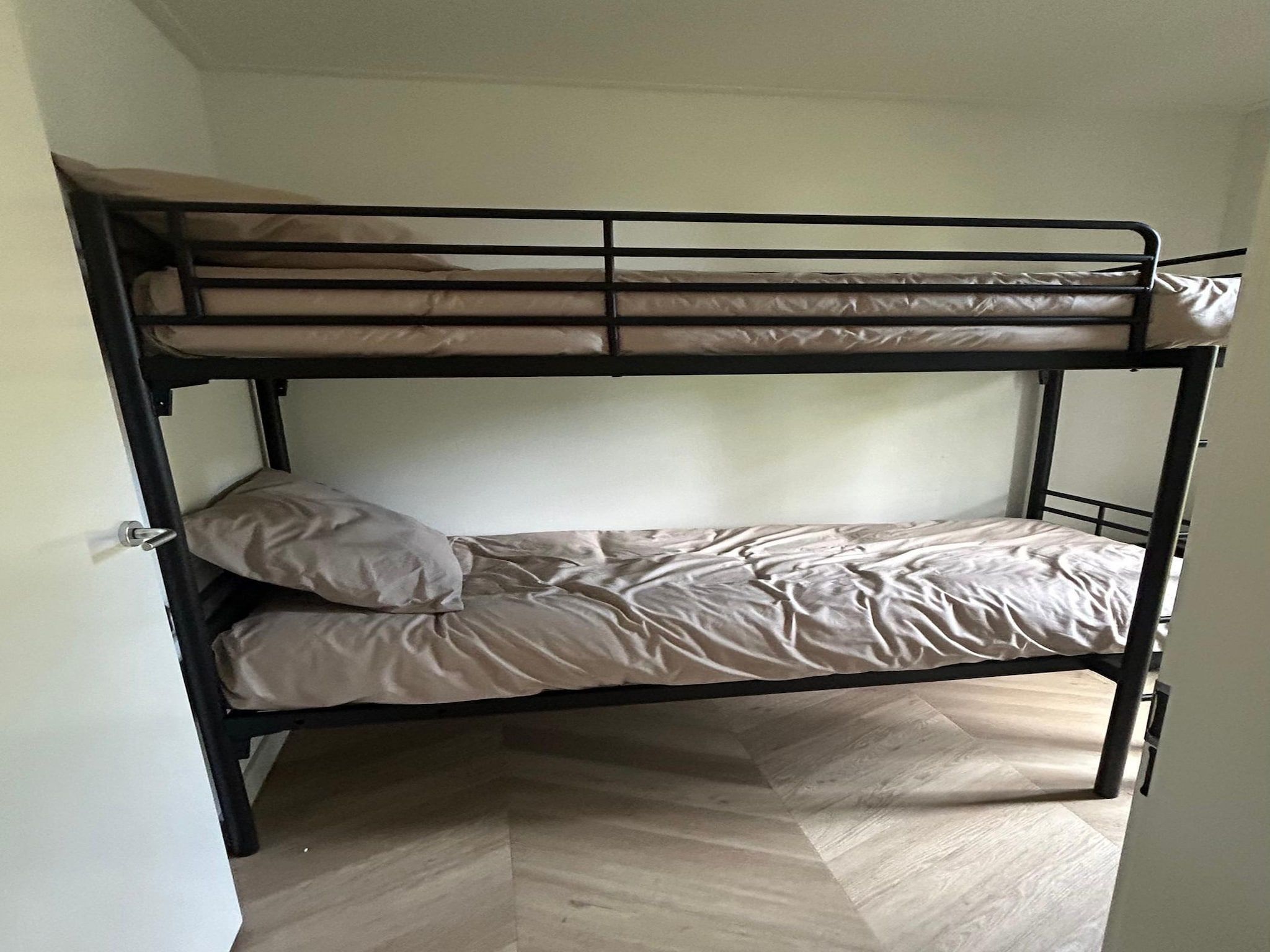 Een slaapkamer van De Steppe 8 pax - 9 in Ulicoten