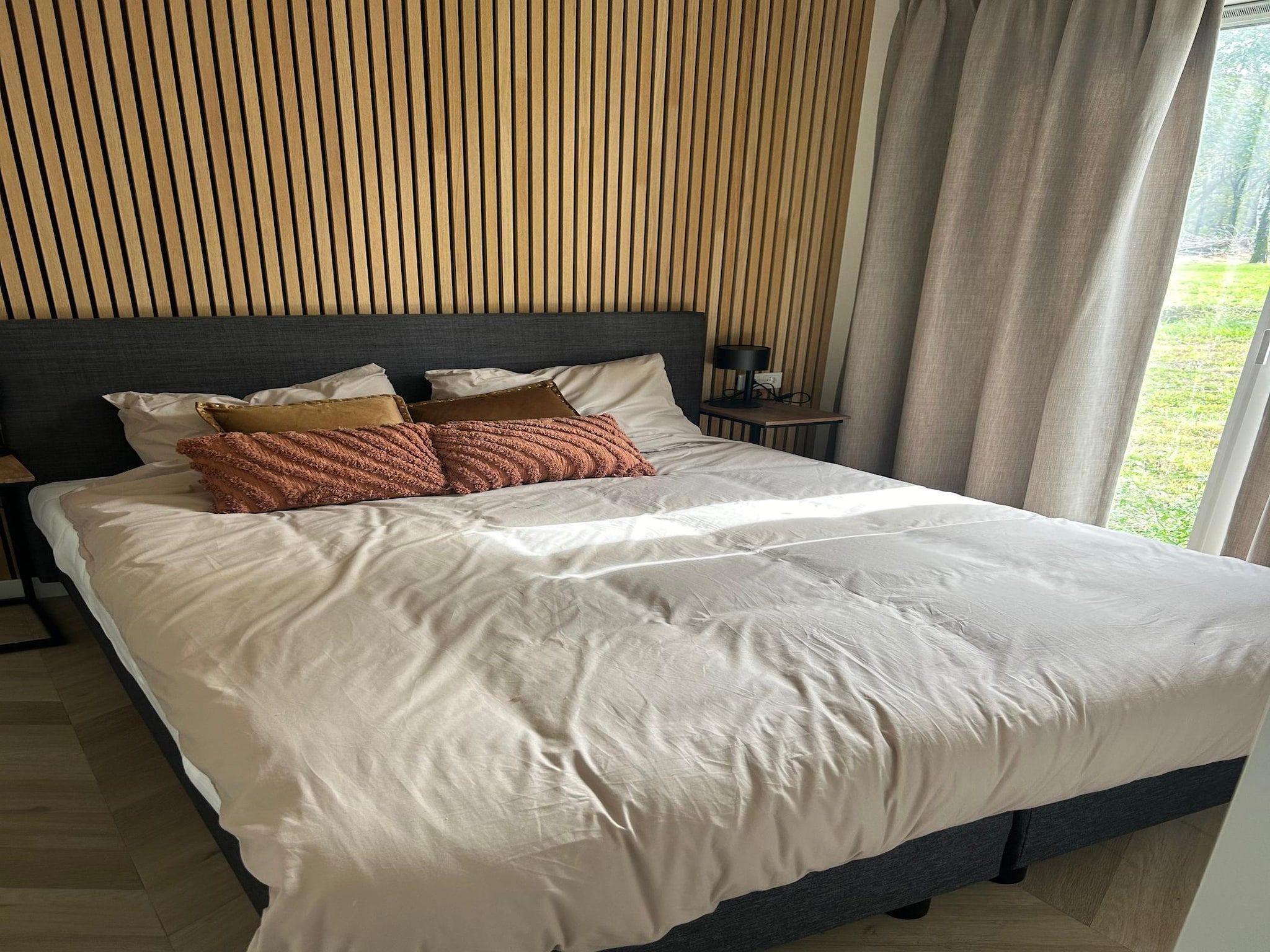 Een slaapkamer van De Steppe 8 pax - 9 in Ulicoten