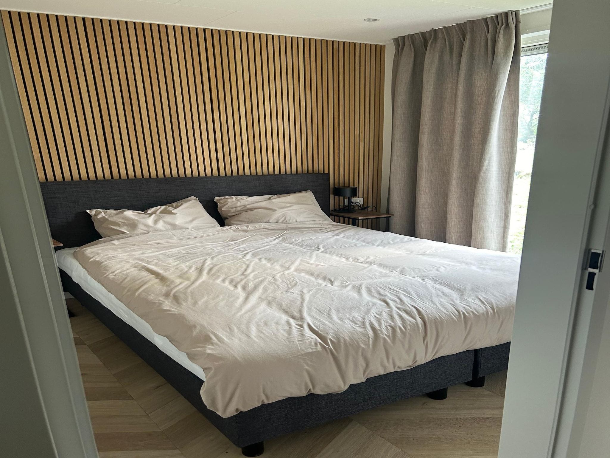 Een slaapkamer van De Steppe 12 pax - 1 in Ulicoten