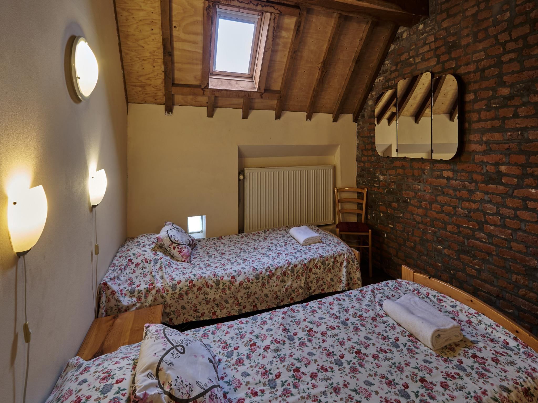 Een slaapkamer van Meschermolen 3 in Mesch-Eijsden