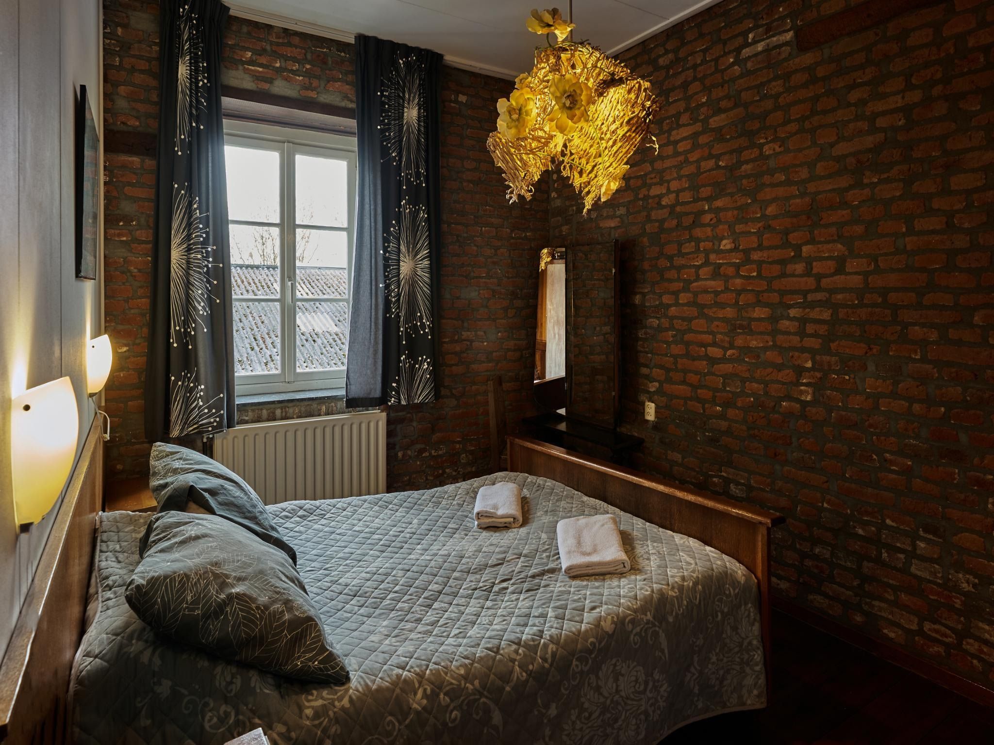 Een slaapkamer van Meschermolen 3 in Mesch-Eijsden