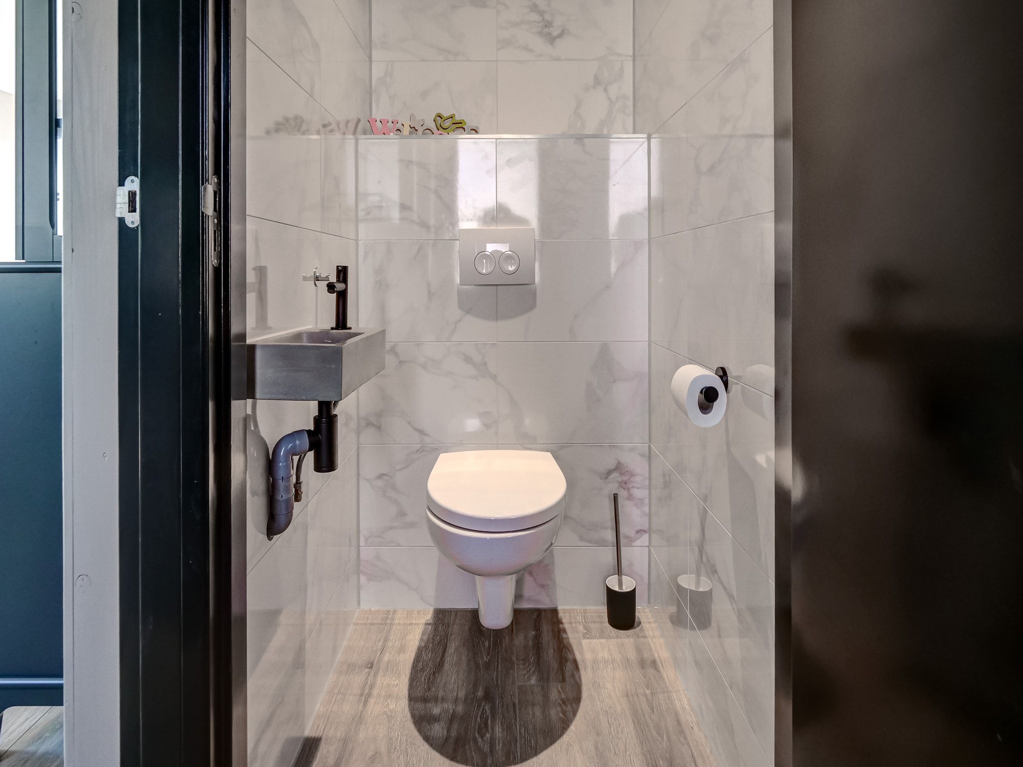 De badkamer van Familiehuis Zee & Zand in Julianadorp