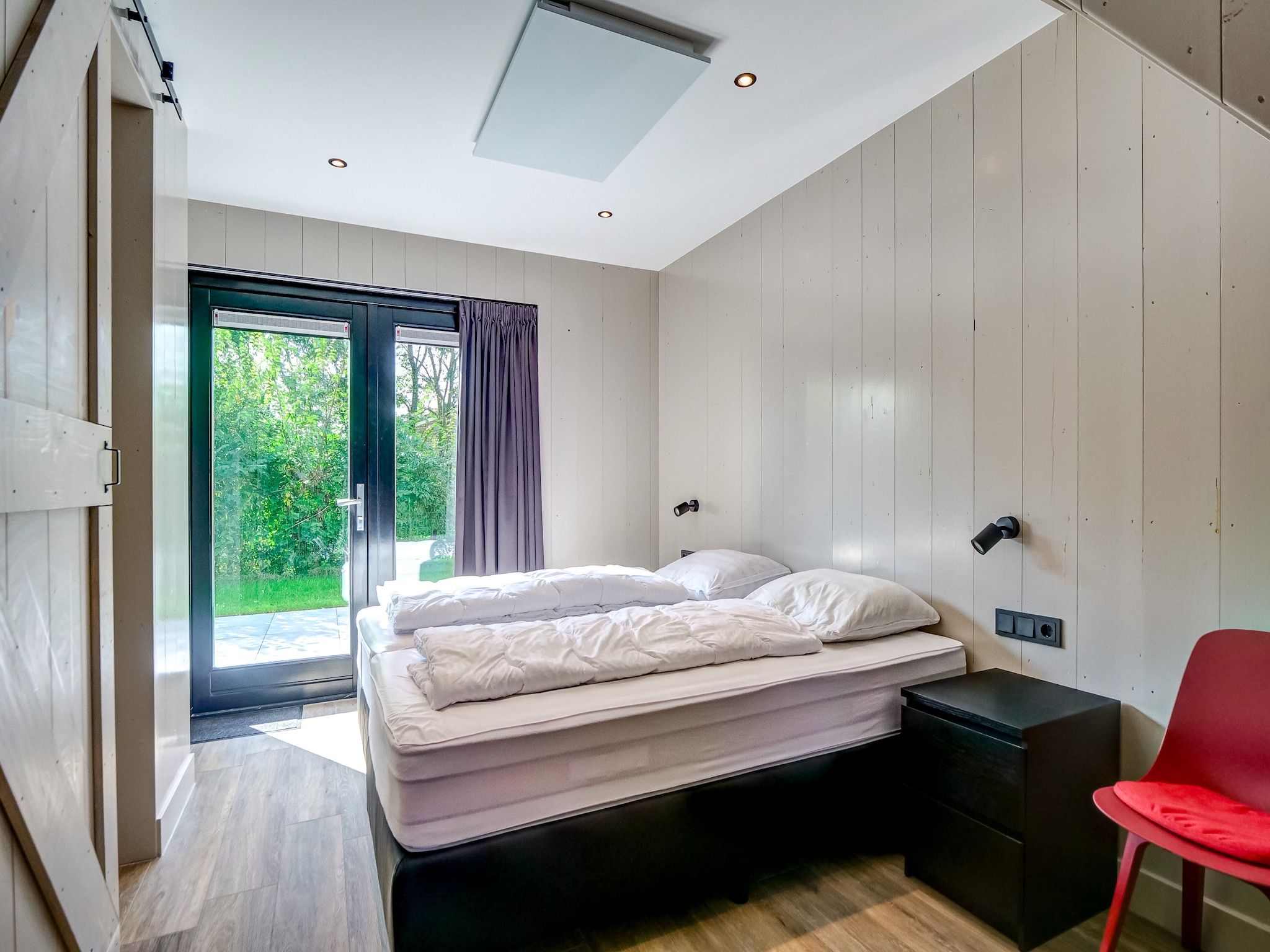 Een slaapkamer van Familiehuis Zee & Zand in Julianadorp