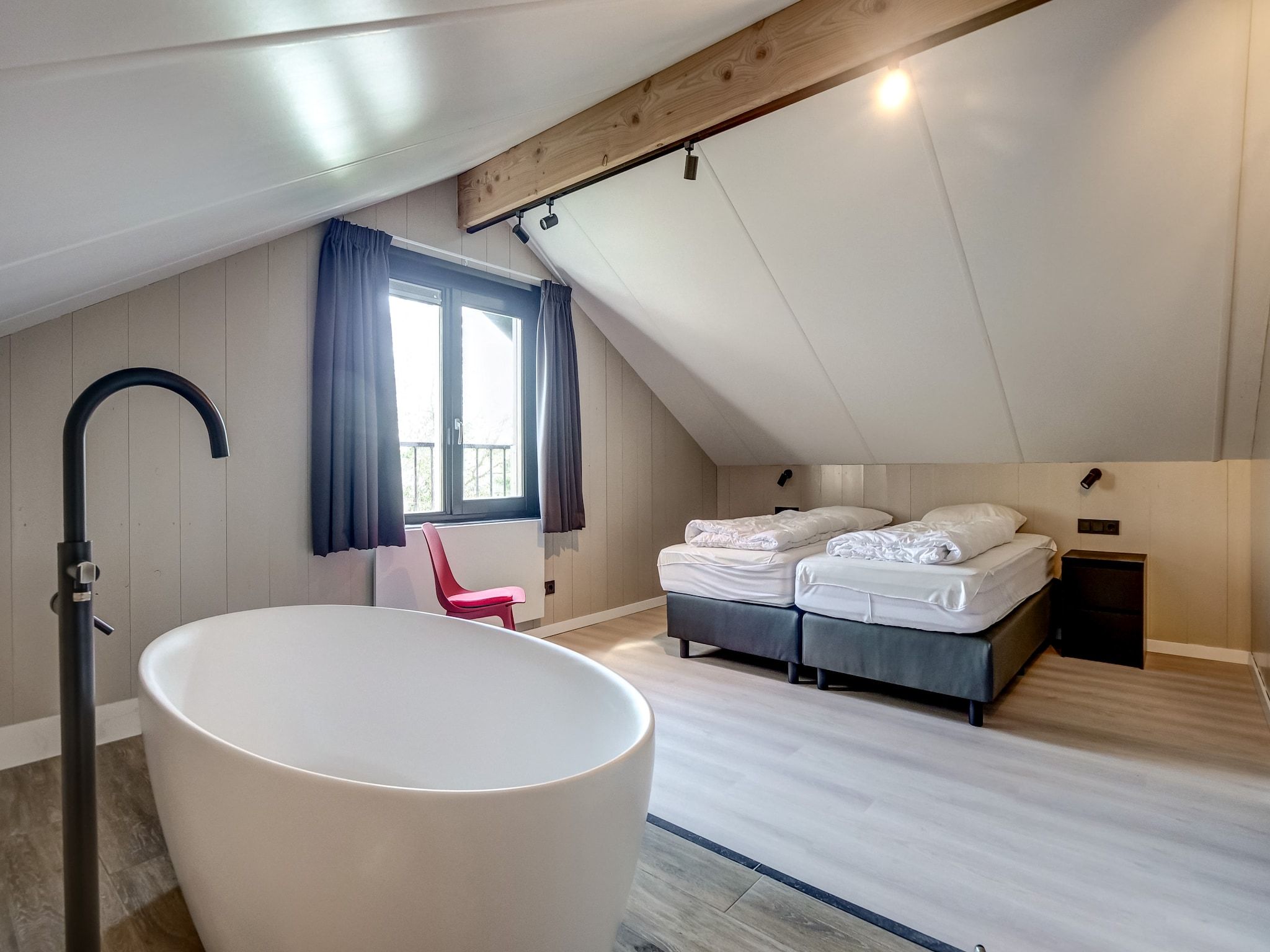 Een slaapkamer van Familiehuis Zee & Zand in Julianadorp