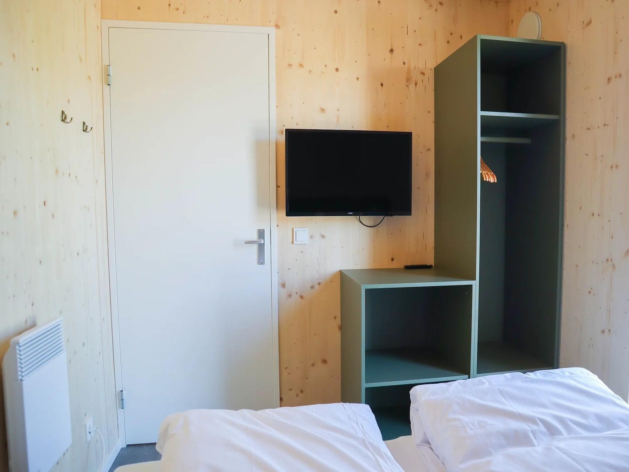 Een slaapkamer van Bungalow Ocean Deluxe 8 Person in ’s-Gravenzande