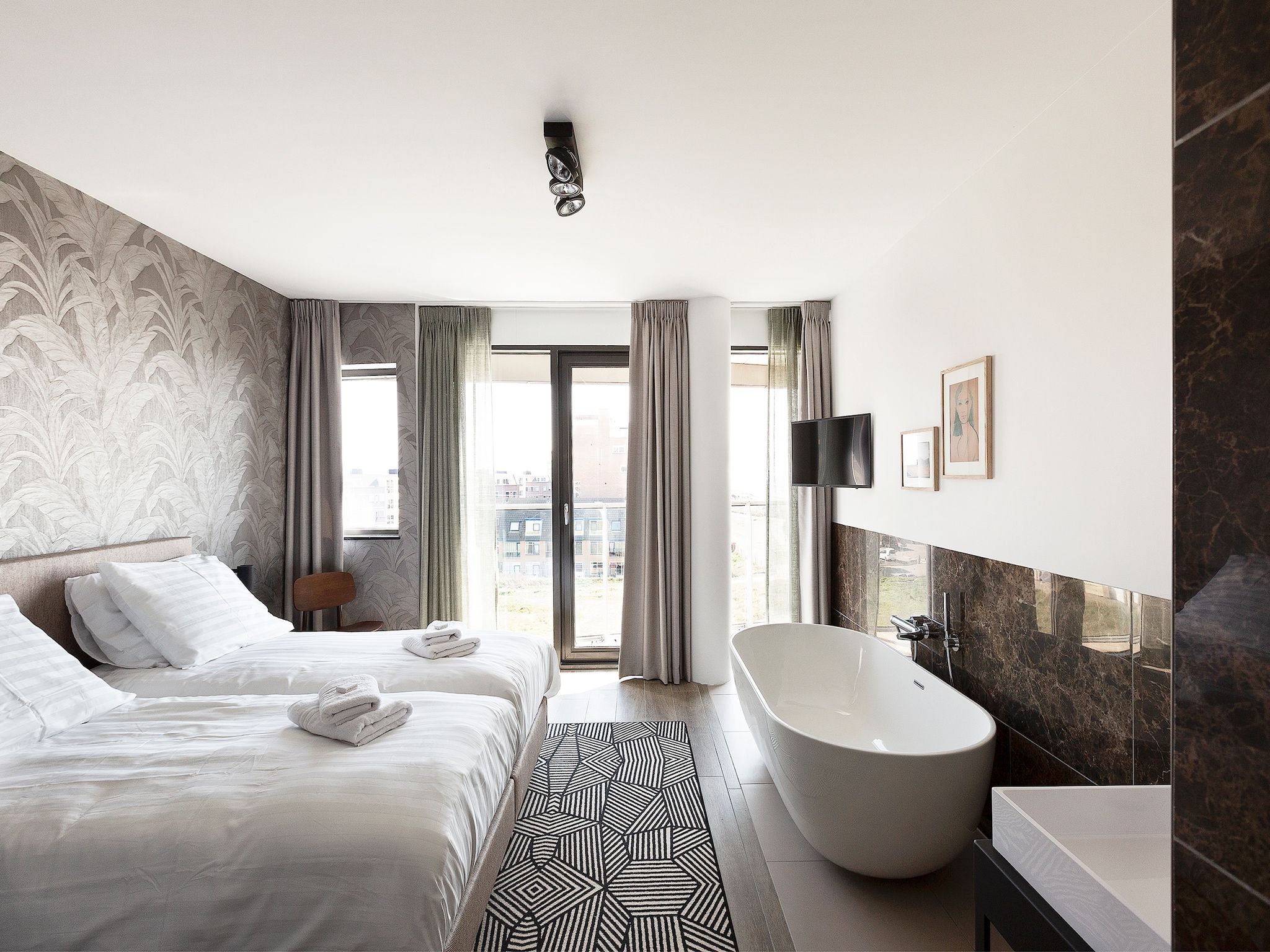 Een slaapkamer van Droomsuites Egmond aan Zee - 8 person apartment in Egmond aan Zee