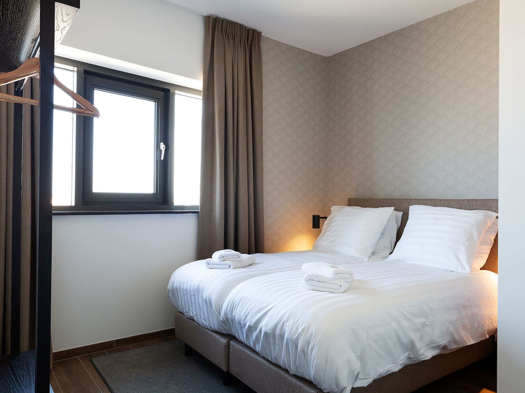 Een slaapkamer van Droomsuites Egmond aan Zee - 8 person apartment in Egmond aan Zee