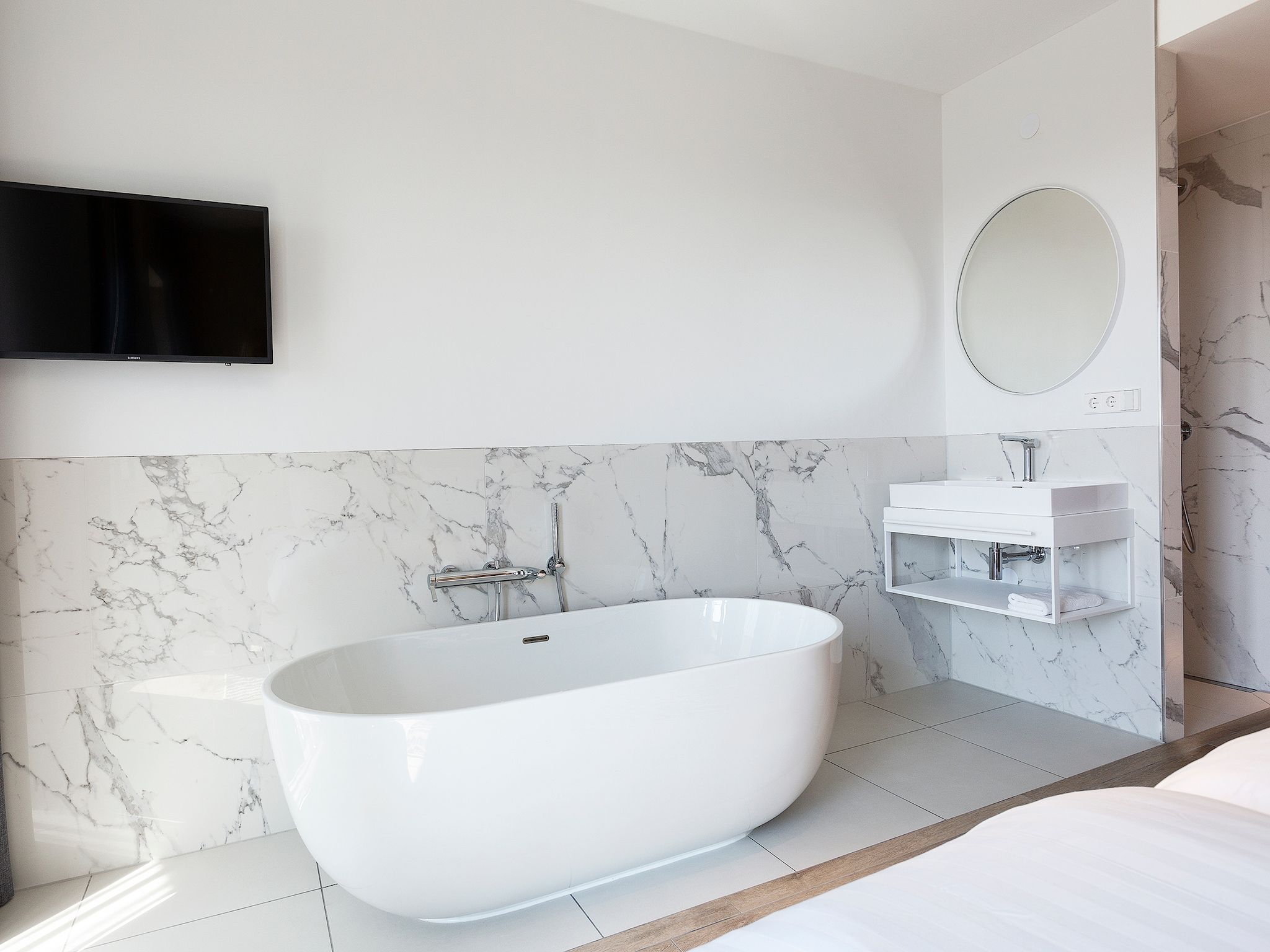 Een slaapkamer van Droomsuites Egmond aan Zee - 8 person penthouse in Egmond aan Zee