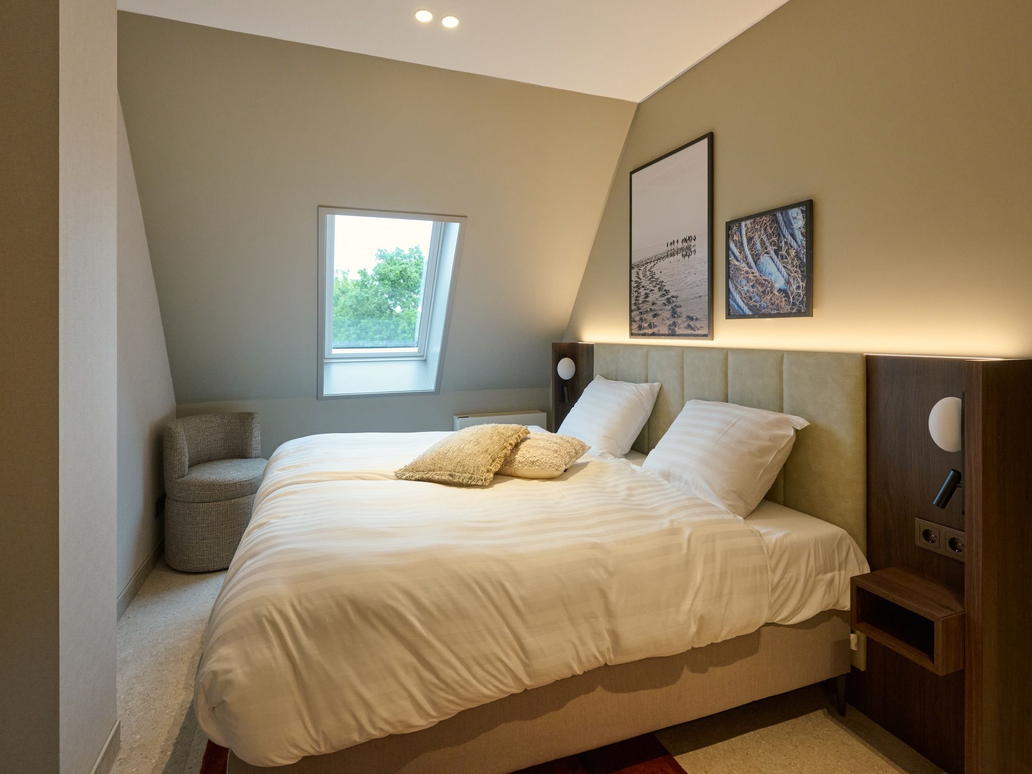 Een slaapkamer van Droomsuites Texel - 8 person apartement in Den Burg