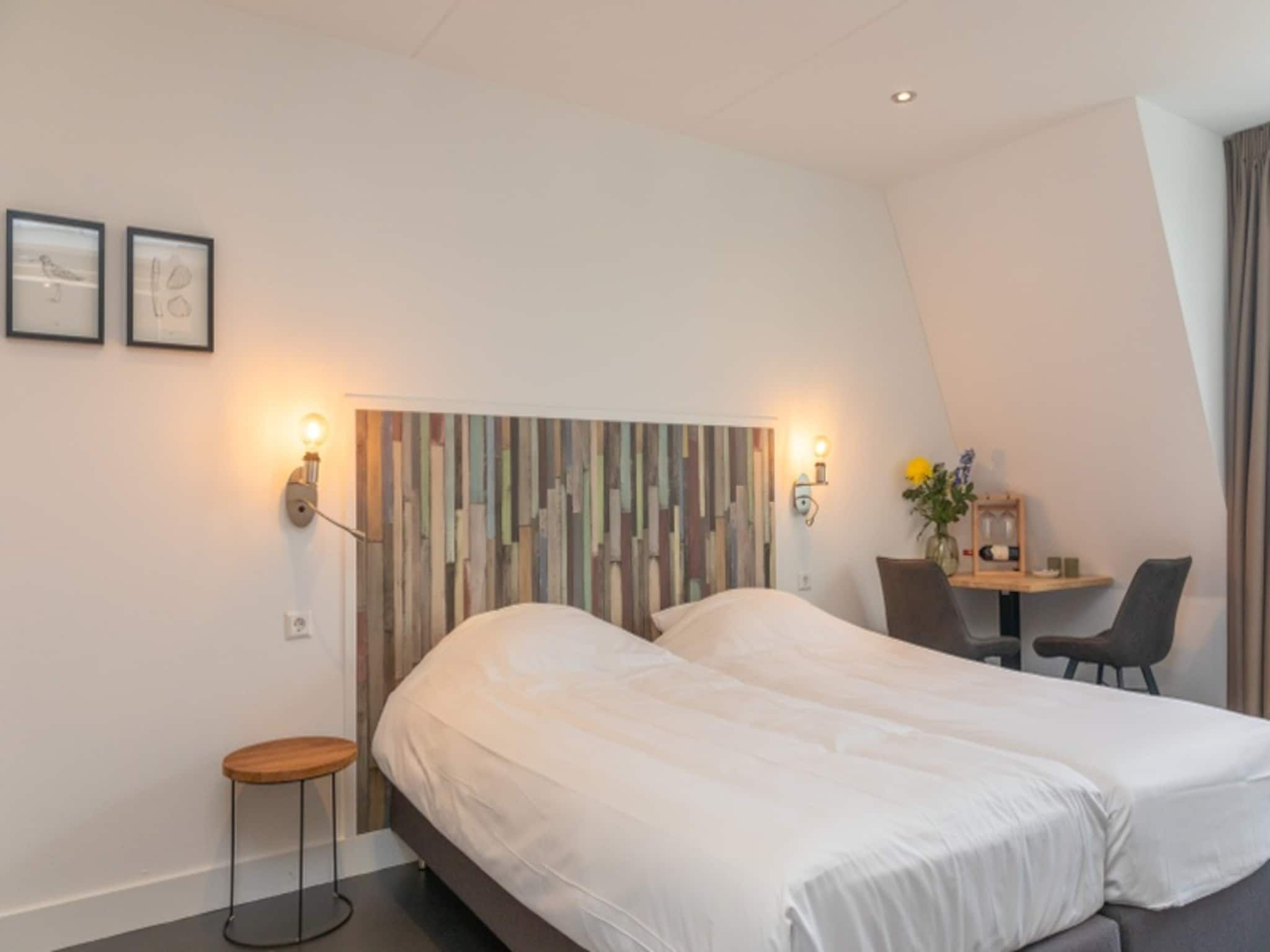 Een slaapkamer van Duynweelde Texel in Den Burg