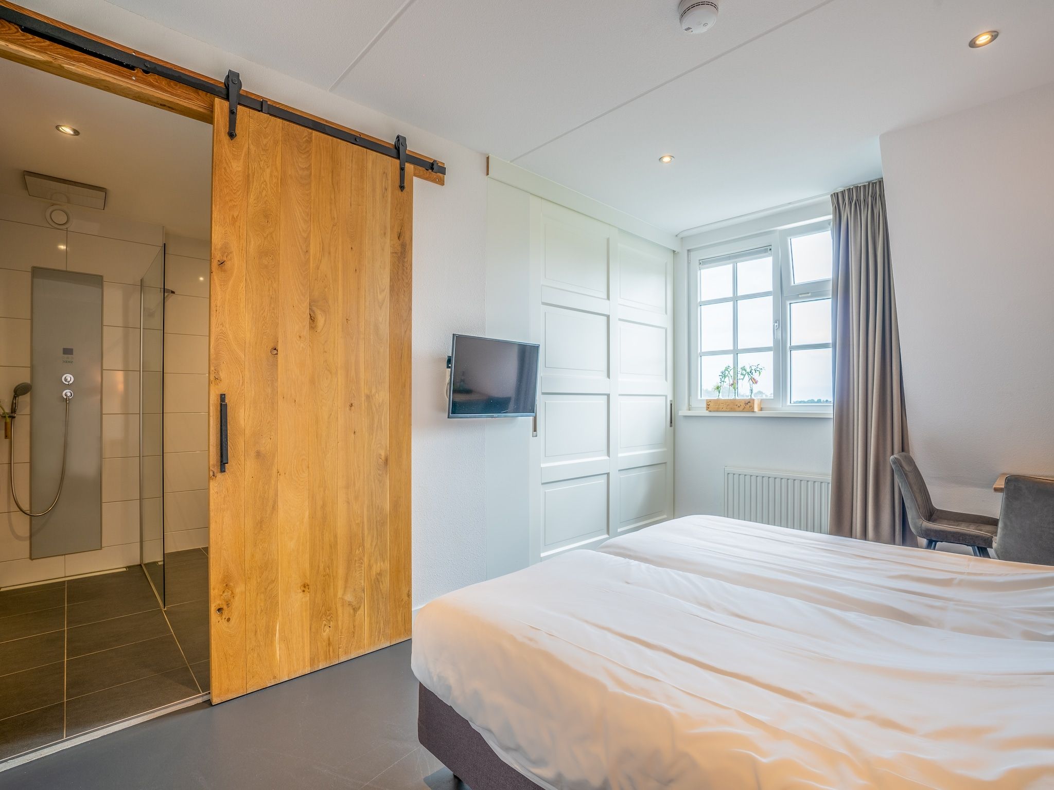 Een slaapkamer van Duynweelde Texel in Den Burg