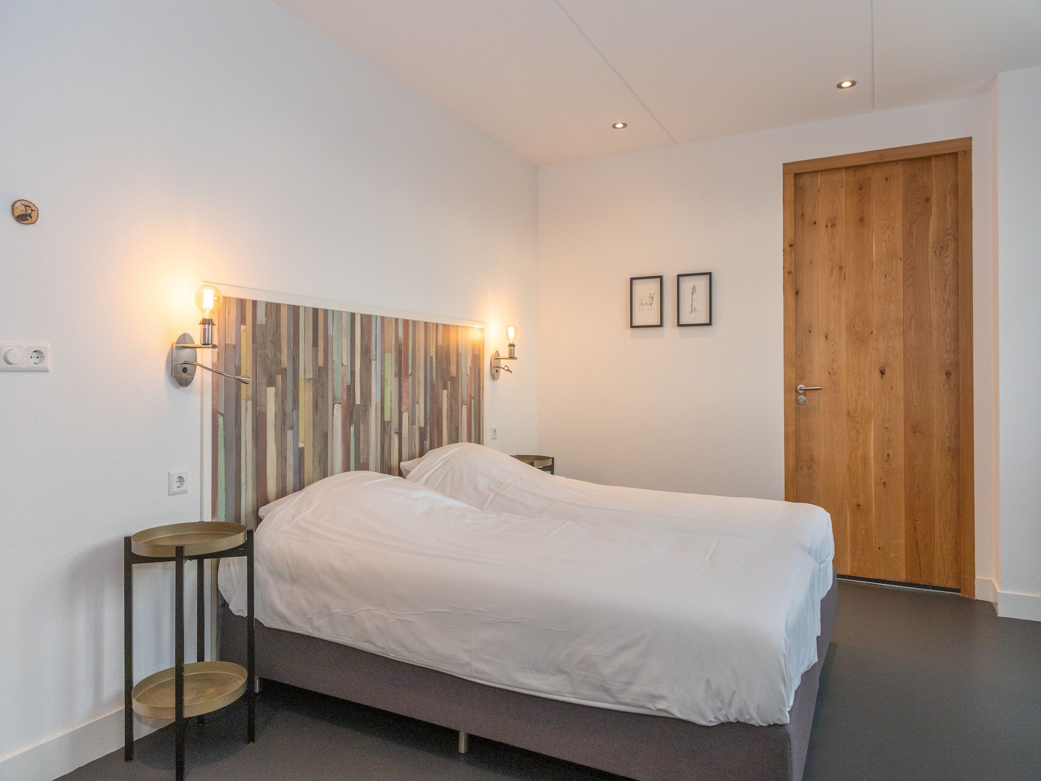 Een slaapkamer van Duynweelde Texel in Den Burg