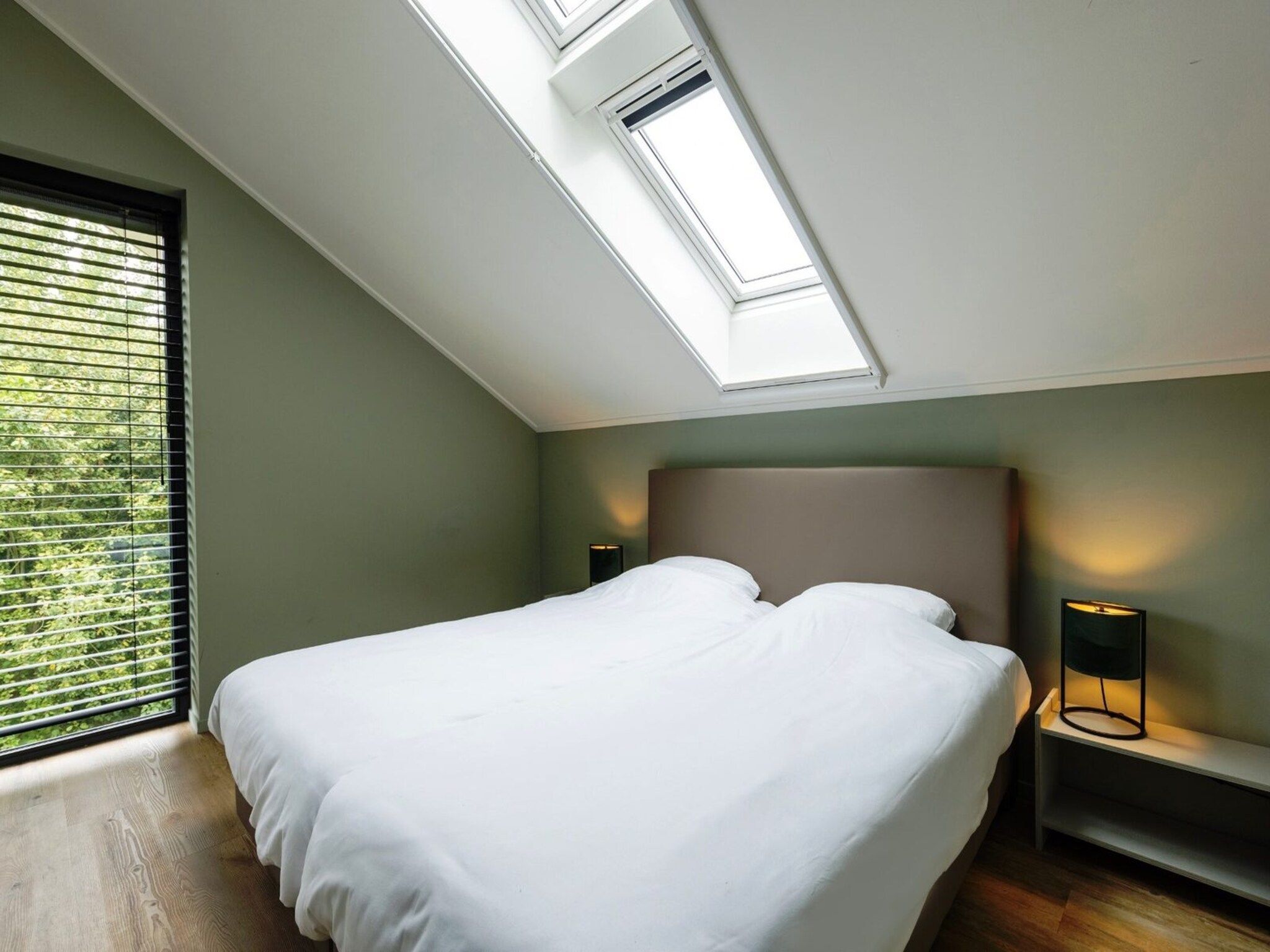 Een slaapkamer van Het Heerlijcke Huis in Aalten