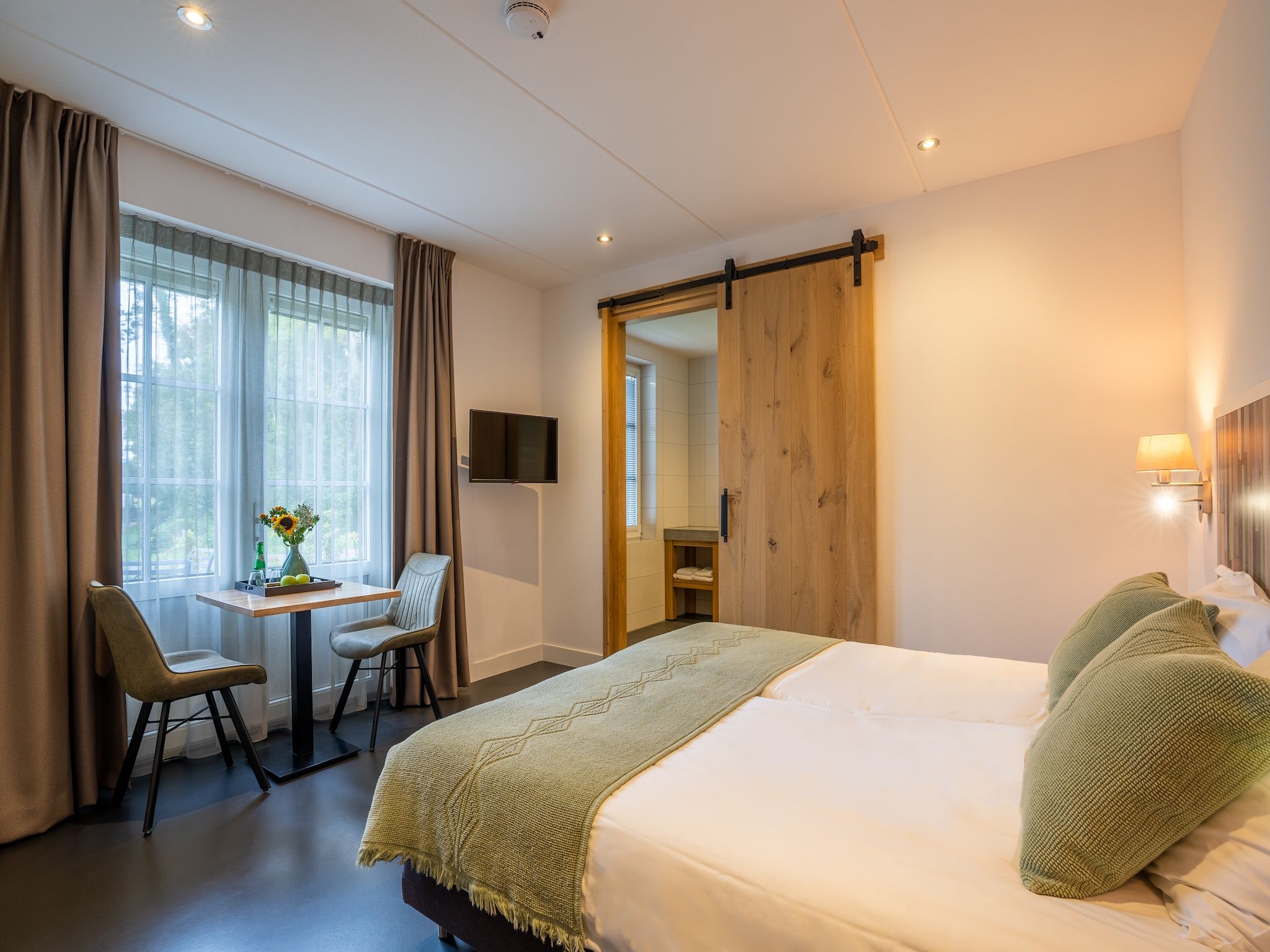 Een slaapkamer van Waddenweelde Texel in Den Burg