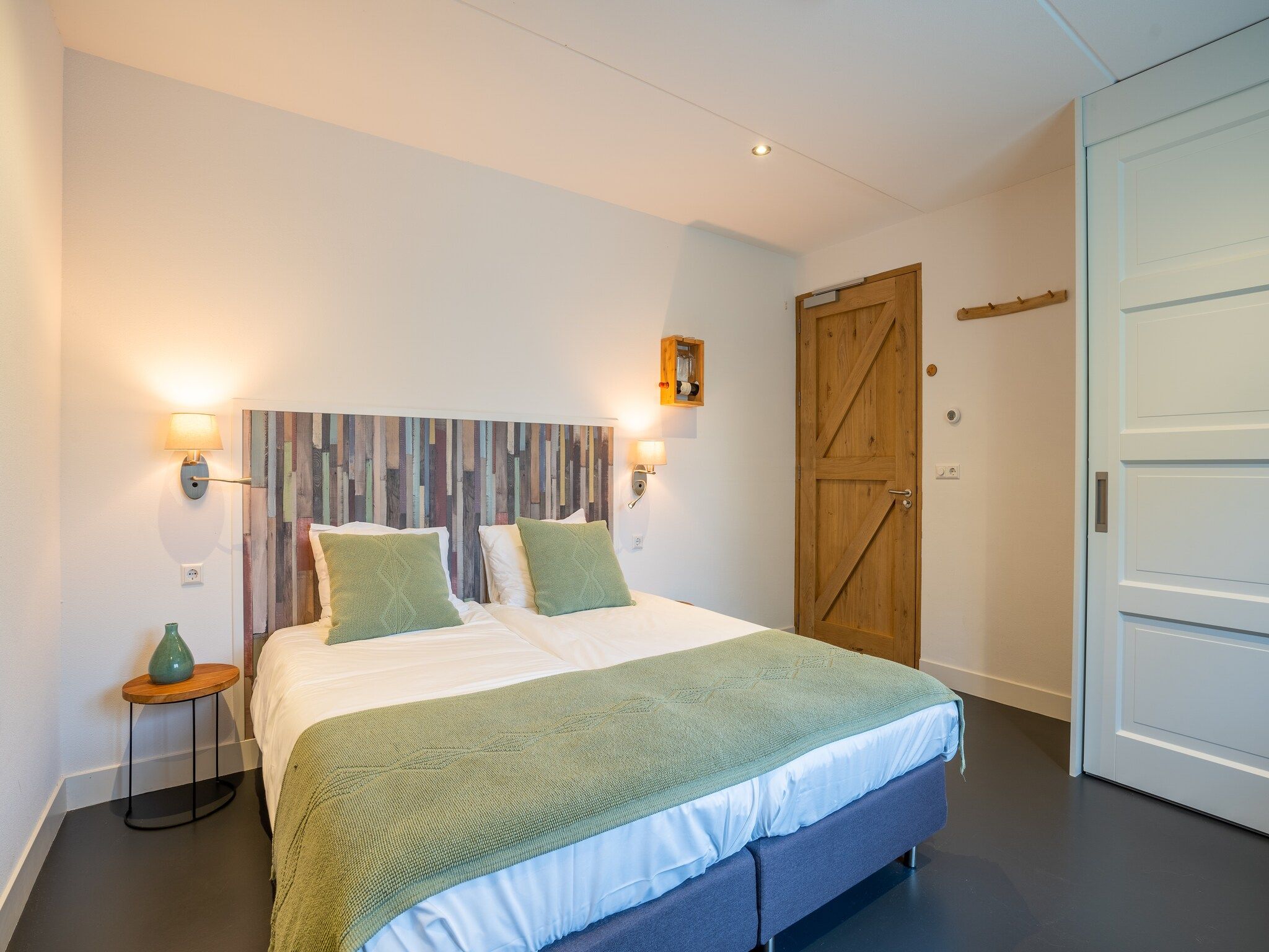 Een slaapkamer van Waddenweelde Texel in Den Burg