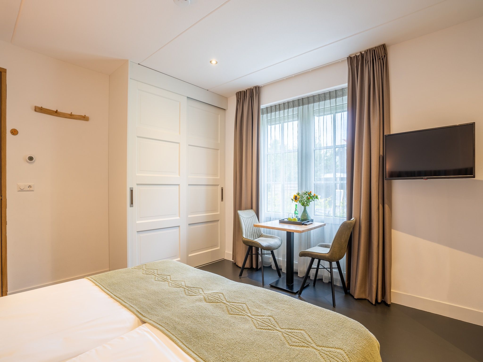 Een slaapkamer van Waddenweelde Texel in Den Burg