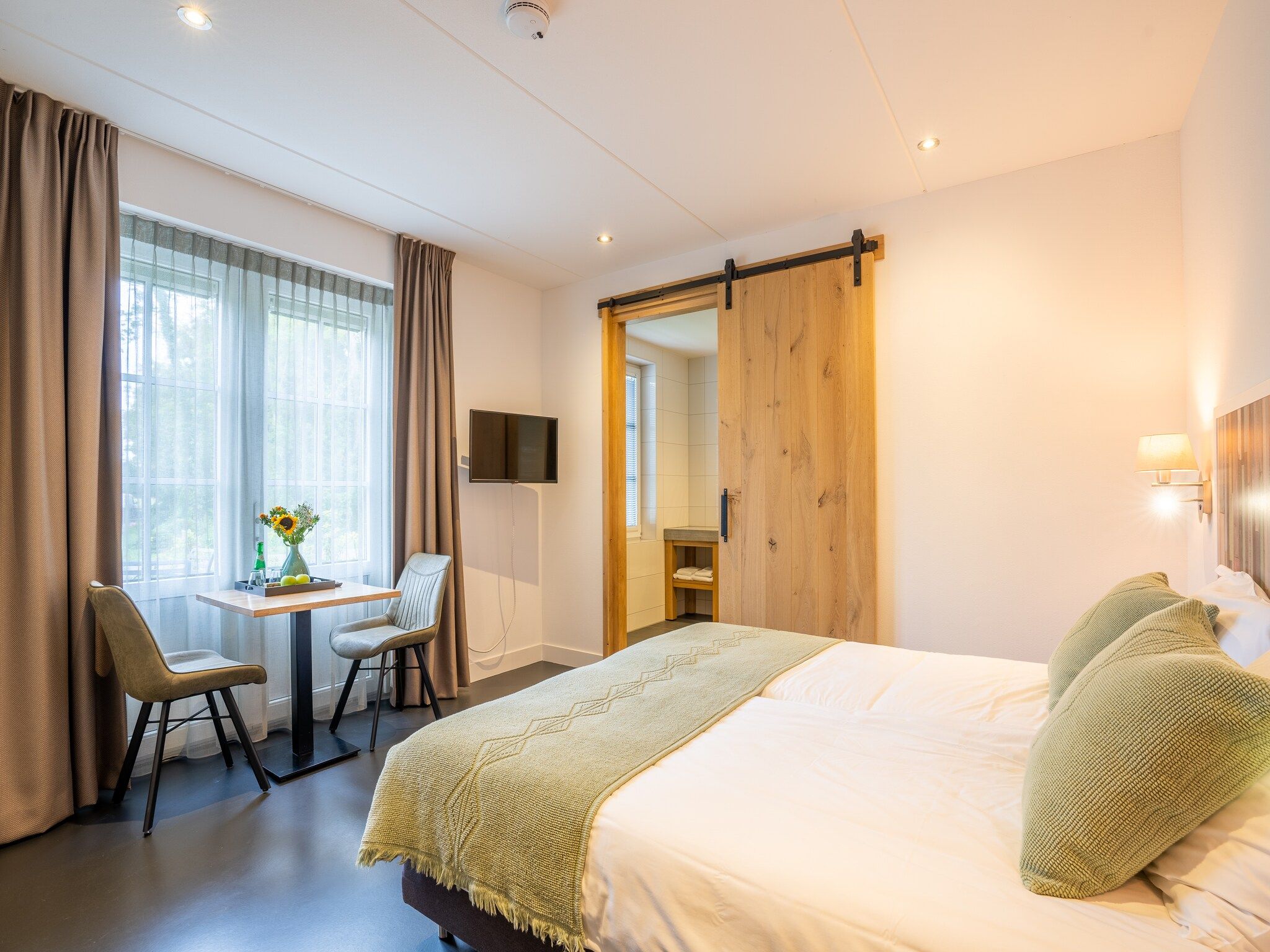 Een slaapkamer van Waddenweelde Texel in Den Burg