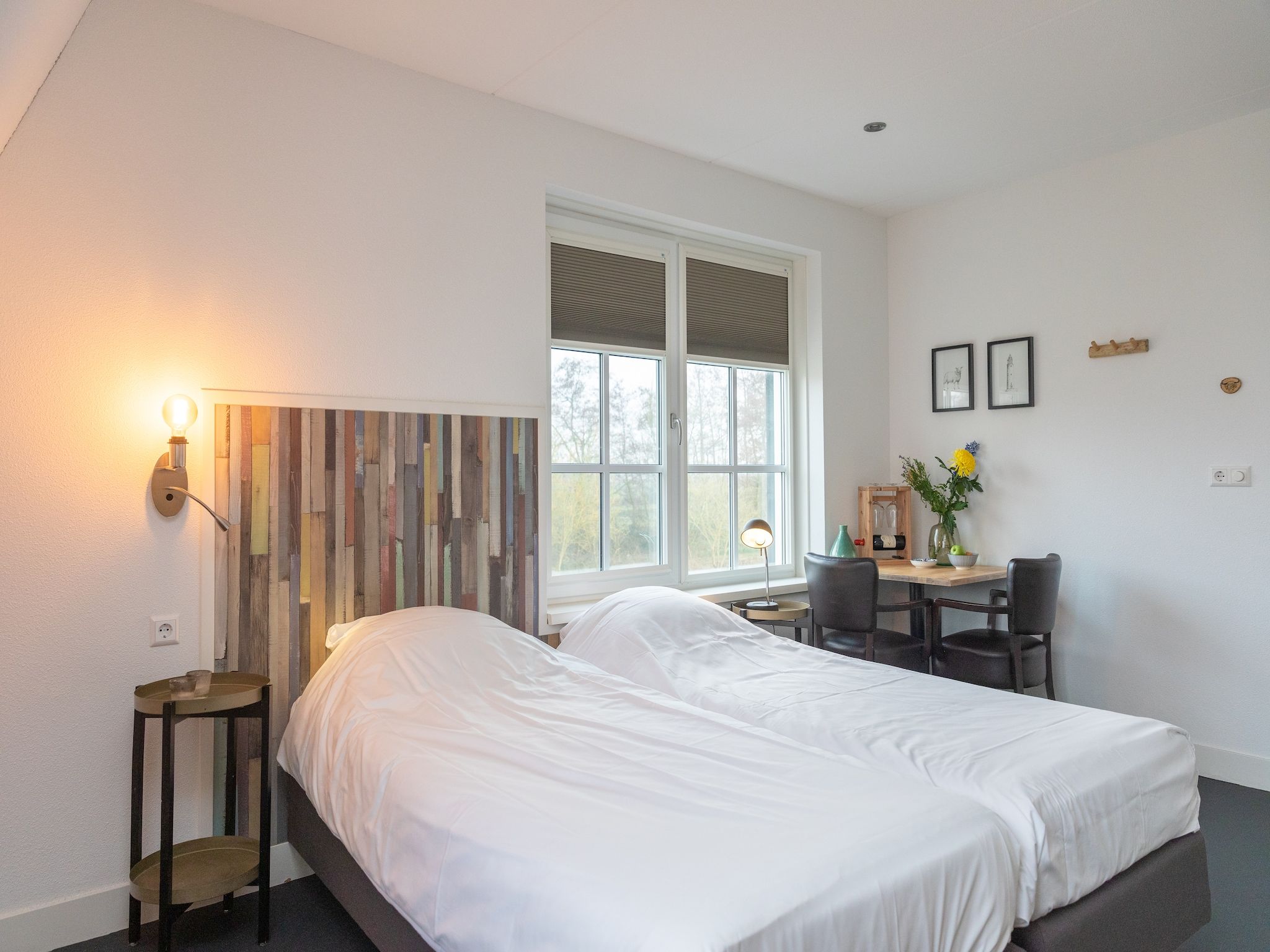 Een slaapkamer van Waddenweelde Texel in Den Burg