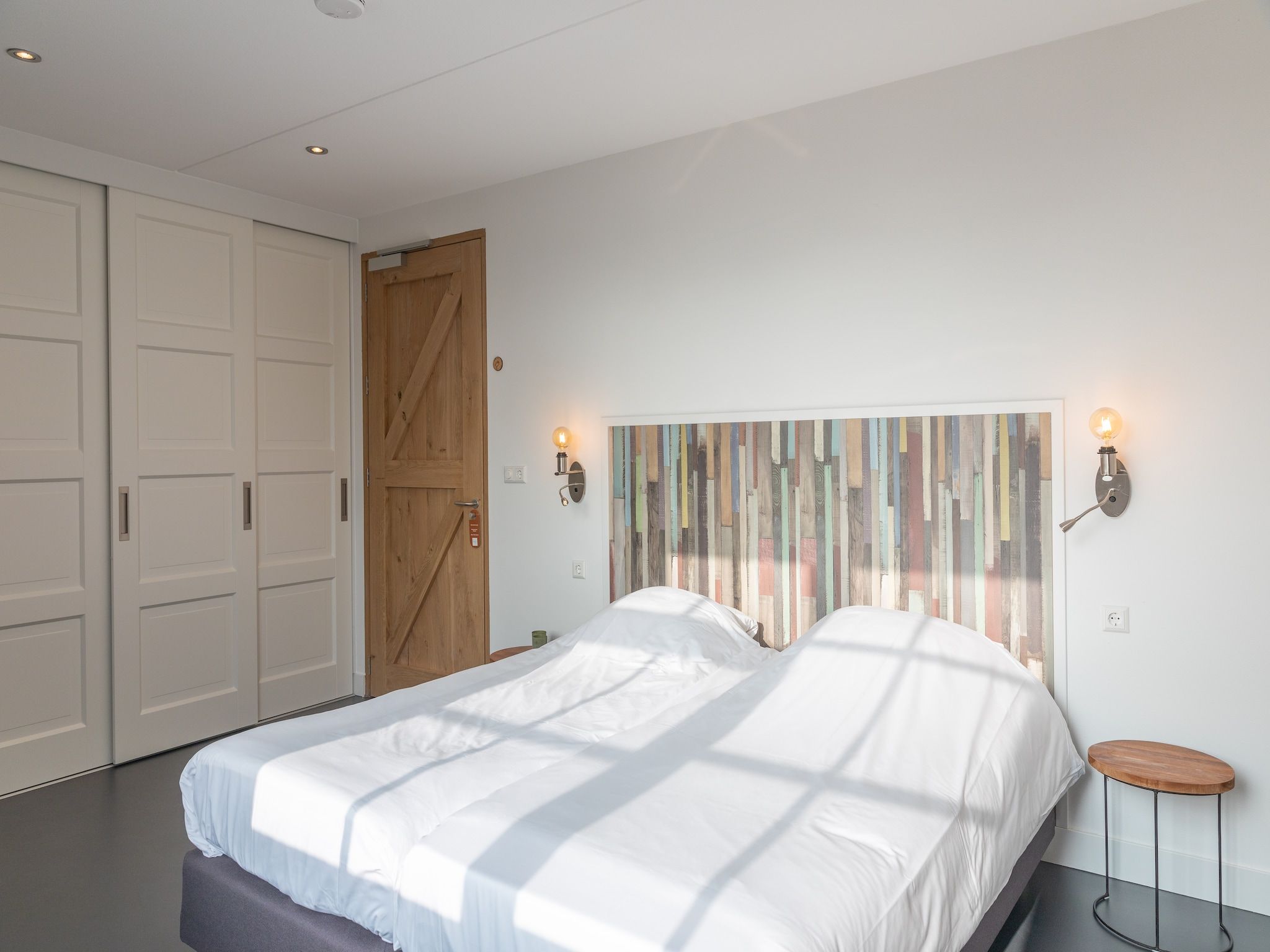 Een slaapkamer van Waddenweelde Texel in Den Burg