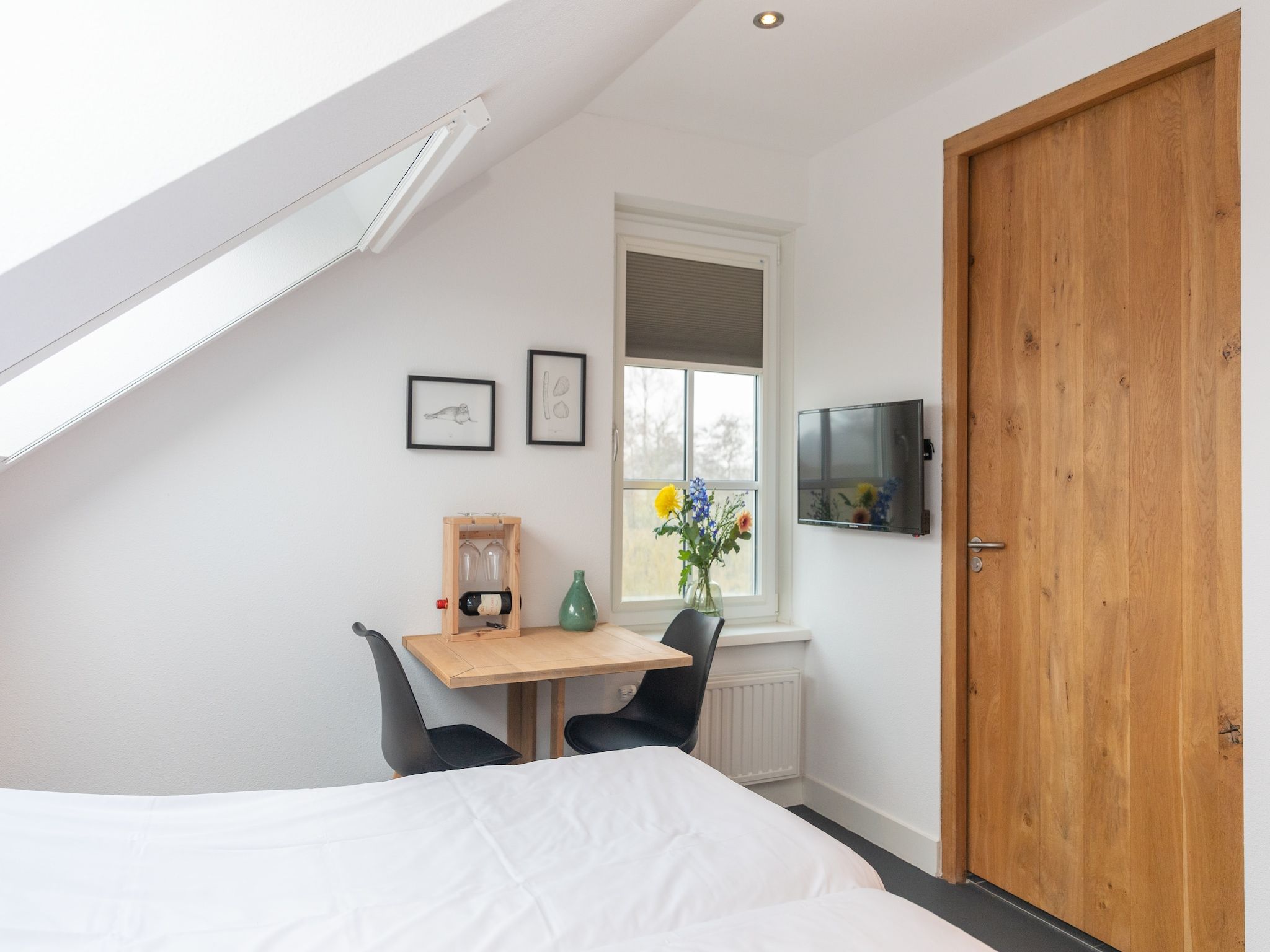 Een slaapkamer van Waddenweelde Texel in Den Burg