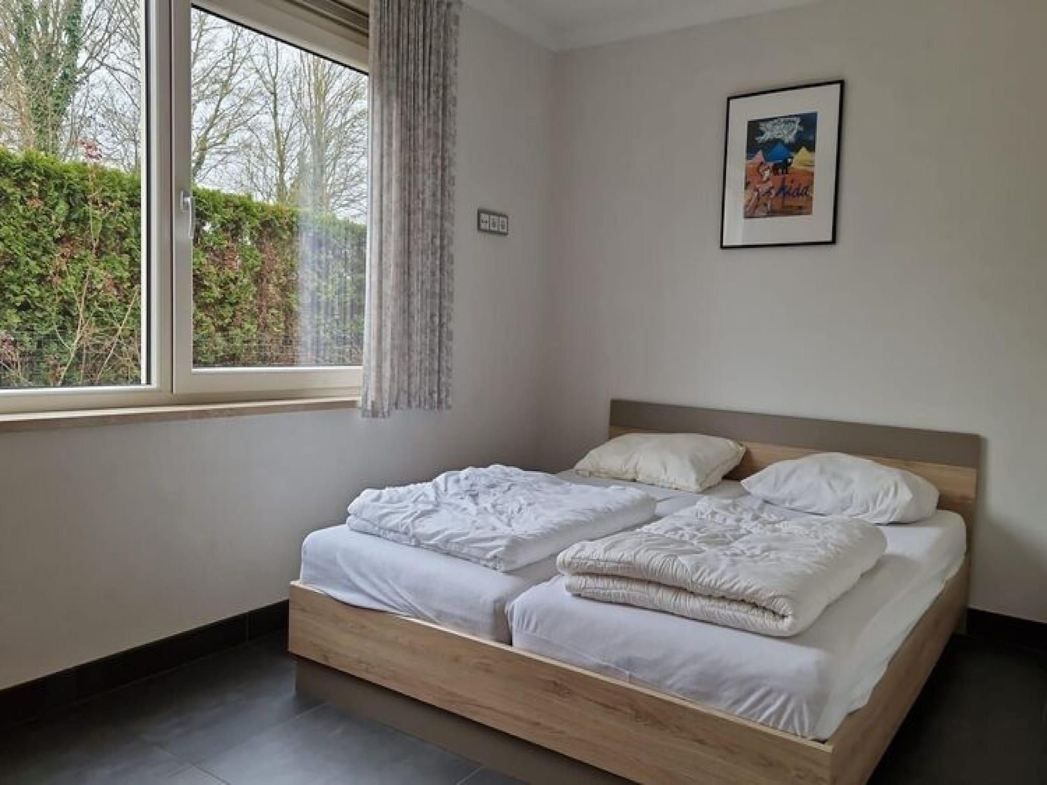 Een slaapkamer van 2 fijne Zeeuwse huisjes in Baarland