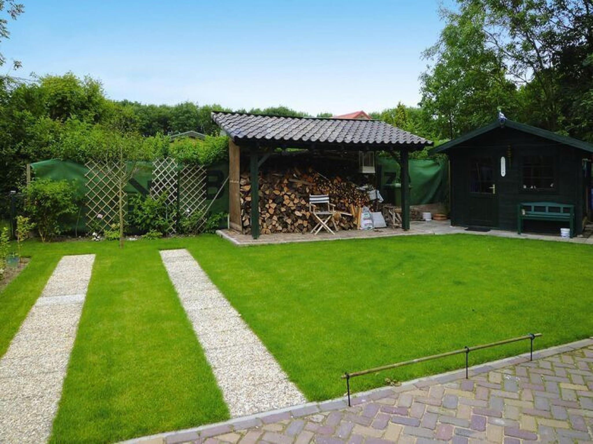 De tuin van 2 fijne Zeeuwse huisjes in Baarland
