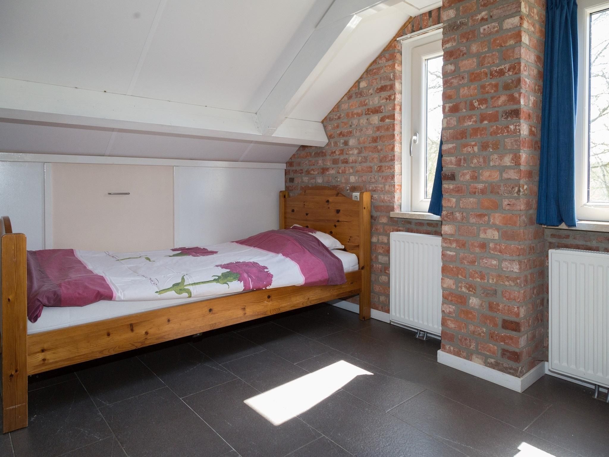 Een slaapkamer van 2 fijne Zeeuwse huisjes in Baarland