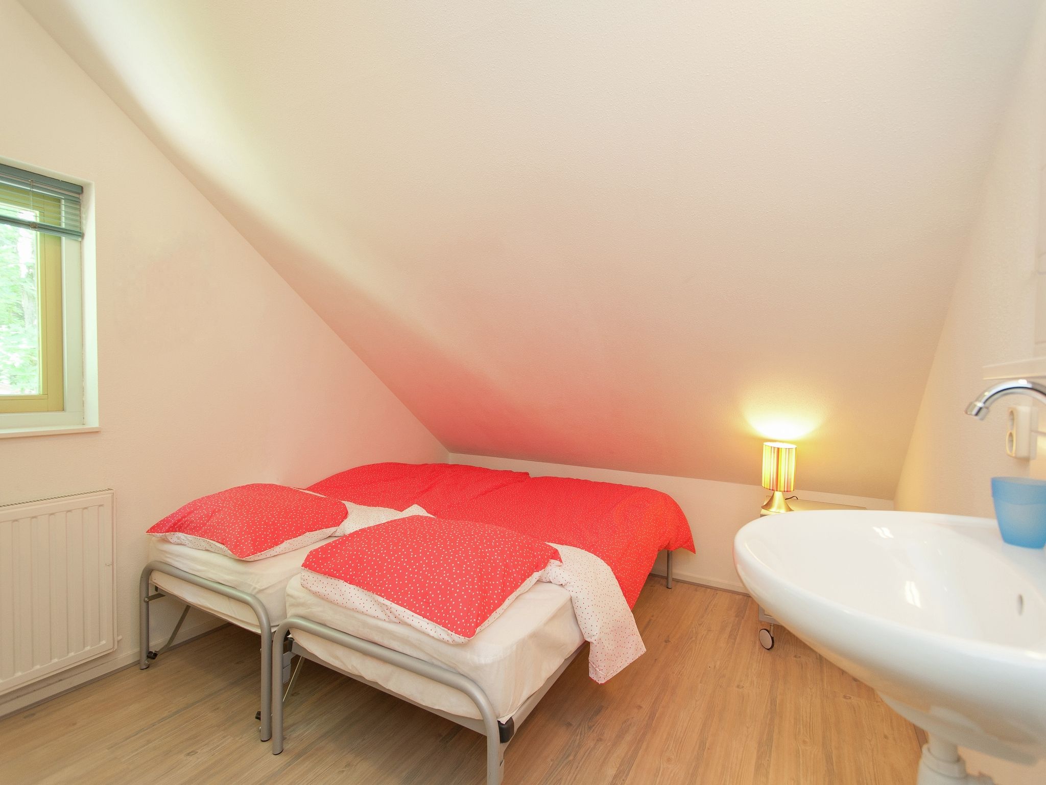 Een slaapkamer van De Meerkoet in Oudemirdum