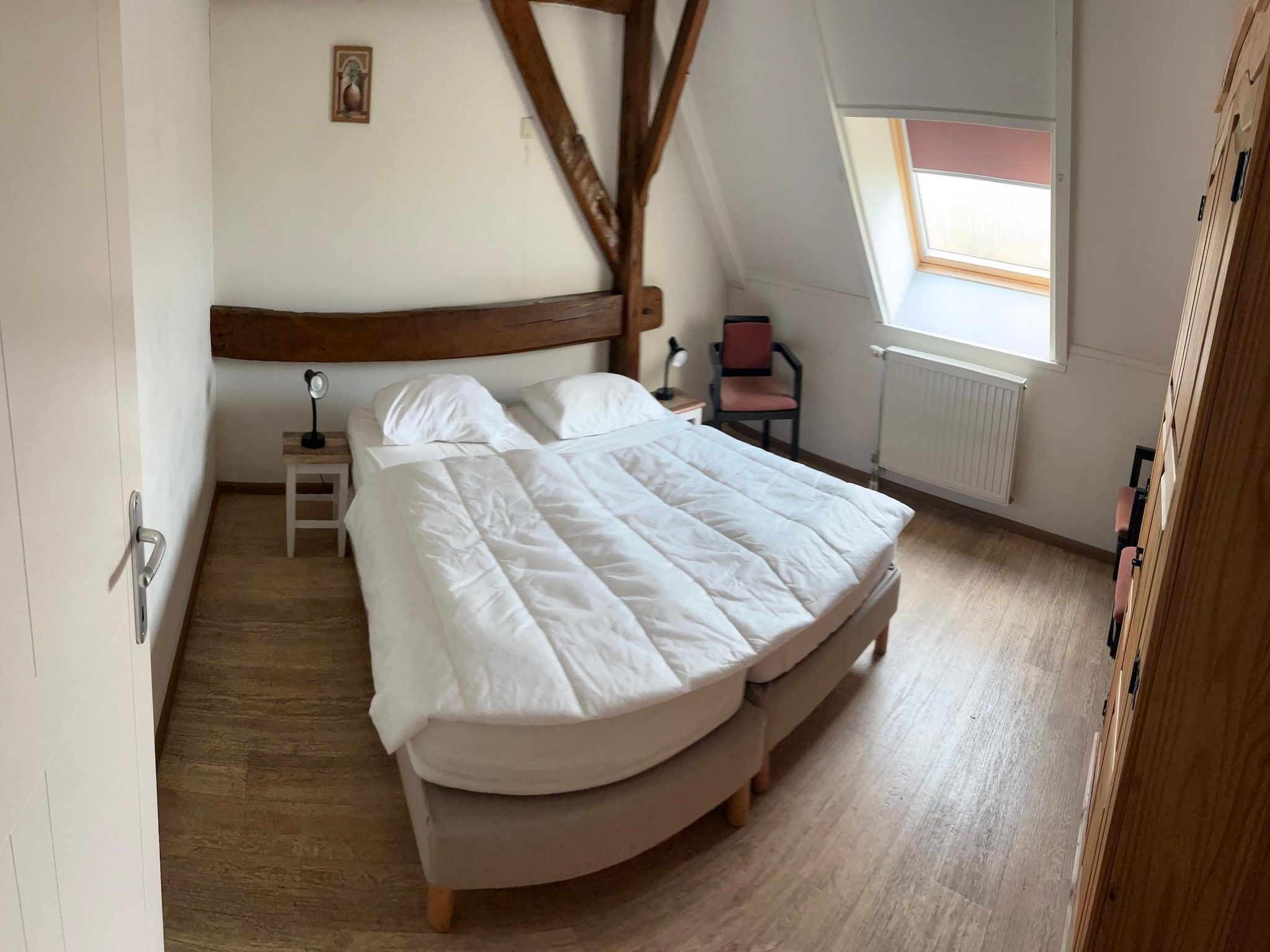 Een slaapkamer van Appartement De Hooizolder in Eede