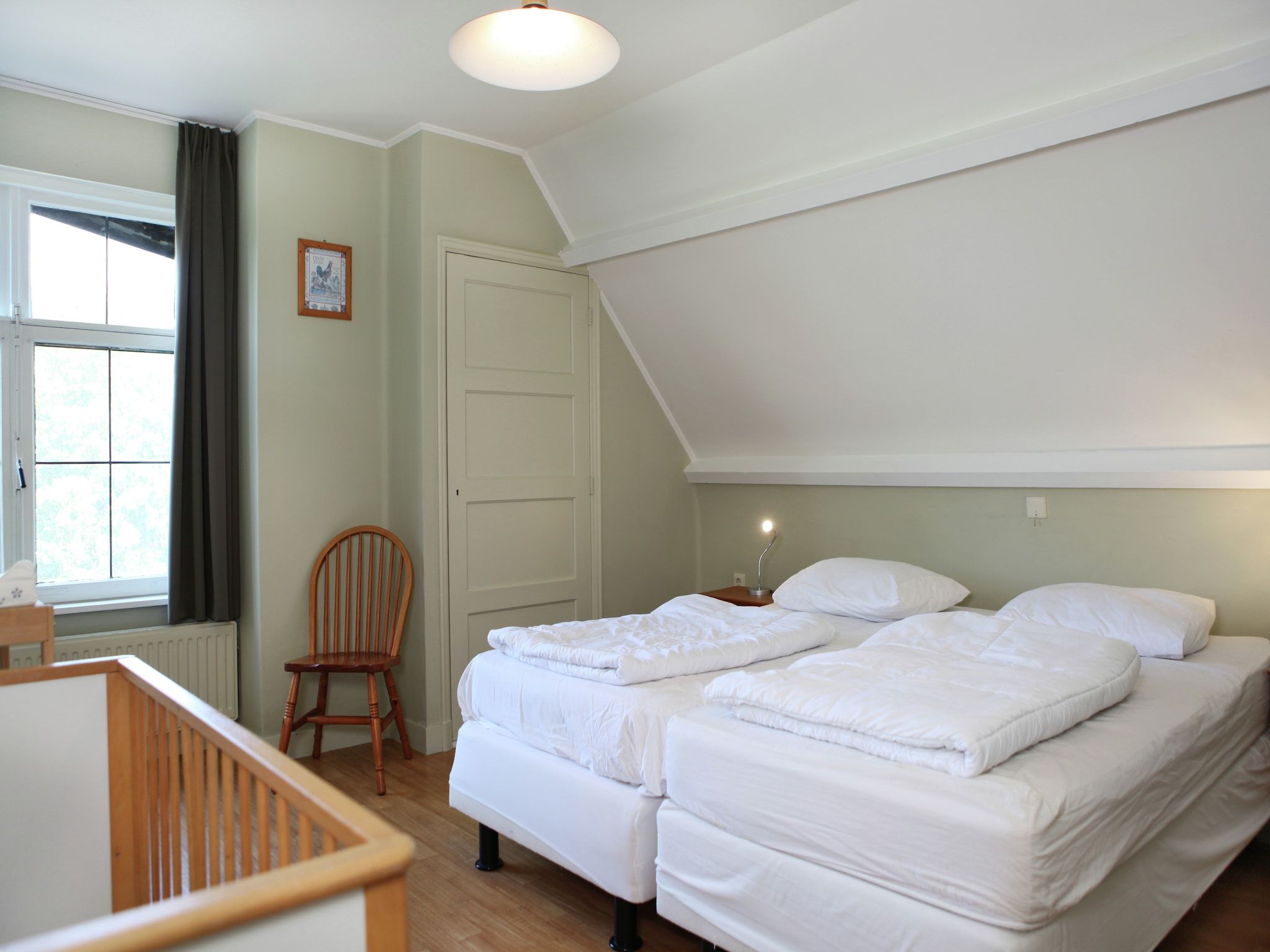 Een slaapkamer van De Biezenpolder 't Groothuus in Eede