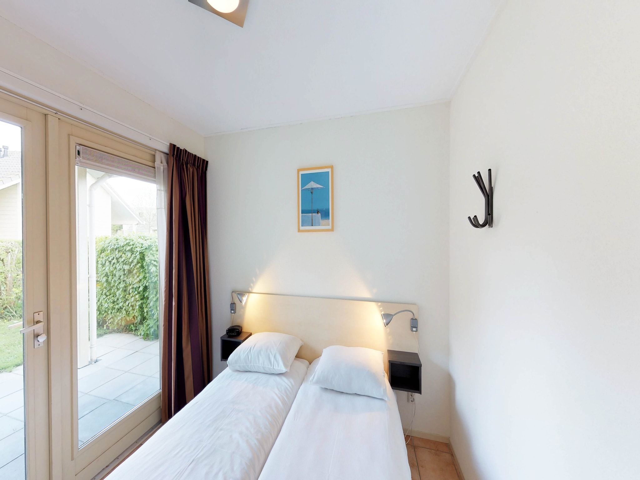 Een slaapkamer van Villapark de Paardekreek 5 in Kortgene