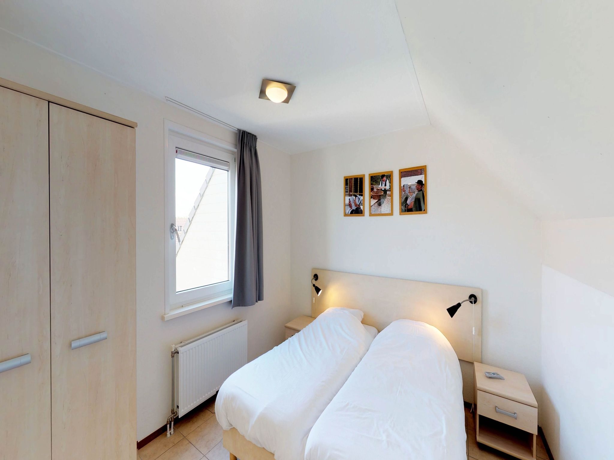 Een slaapkamer van Villapark de Paardekreek 6 in Kortgene