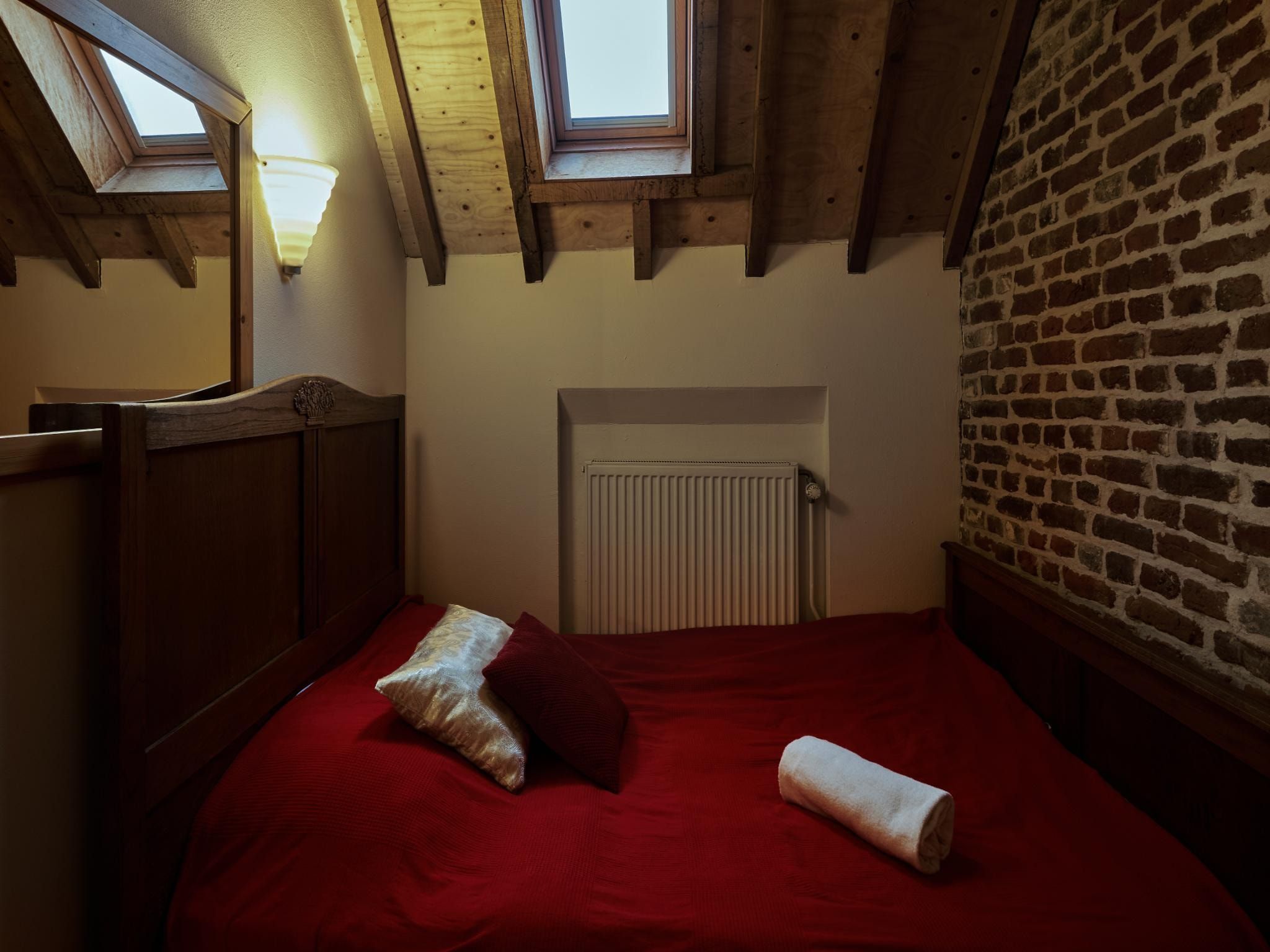 Een slaapkamer van Meschermolen 10 in Mesch-Eijsden