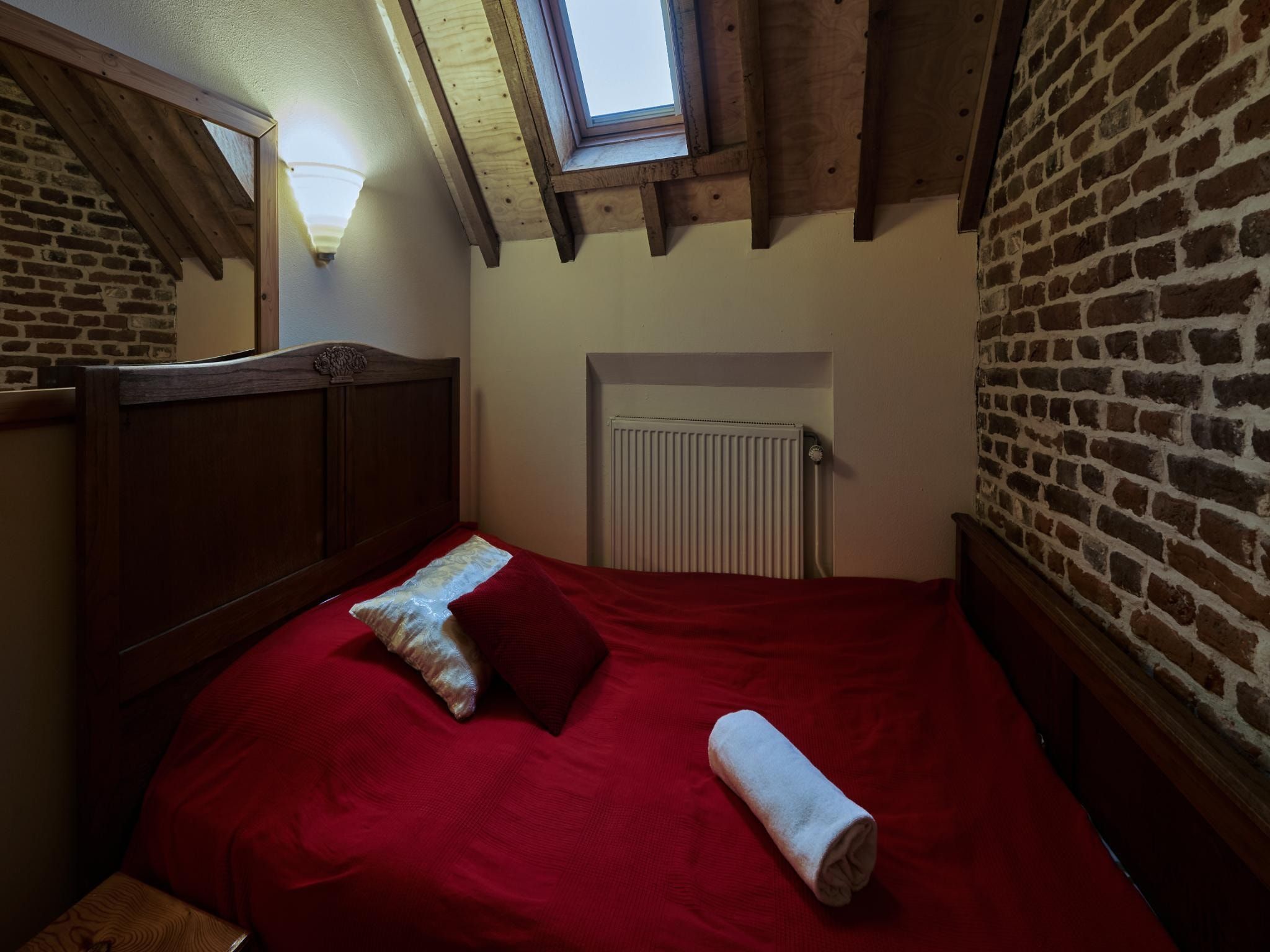 Een slaapkamer van Meschermolen 10 in Mesch-Eijsden