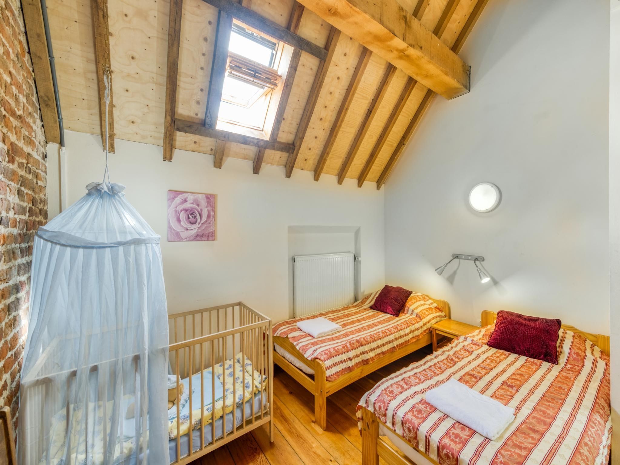 Een slaapkamer van Meschermolen 6 in Mesch-Eijsden