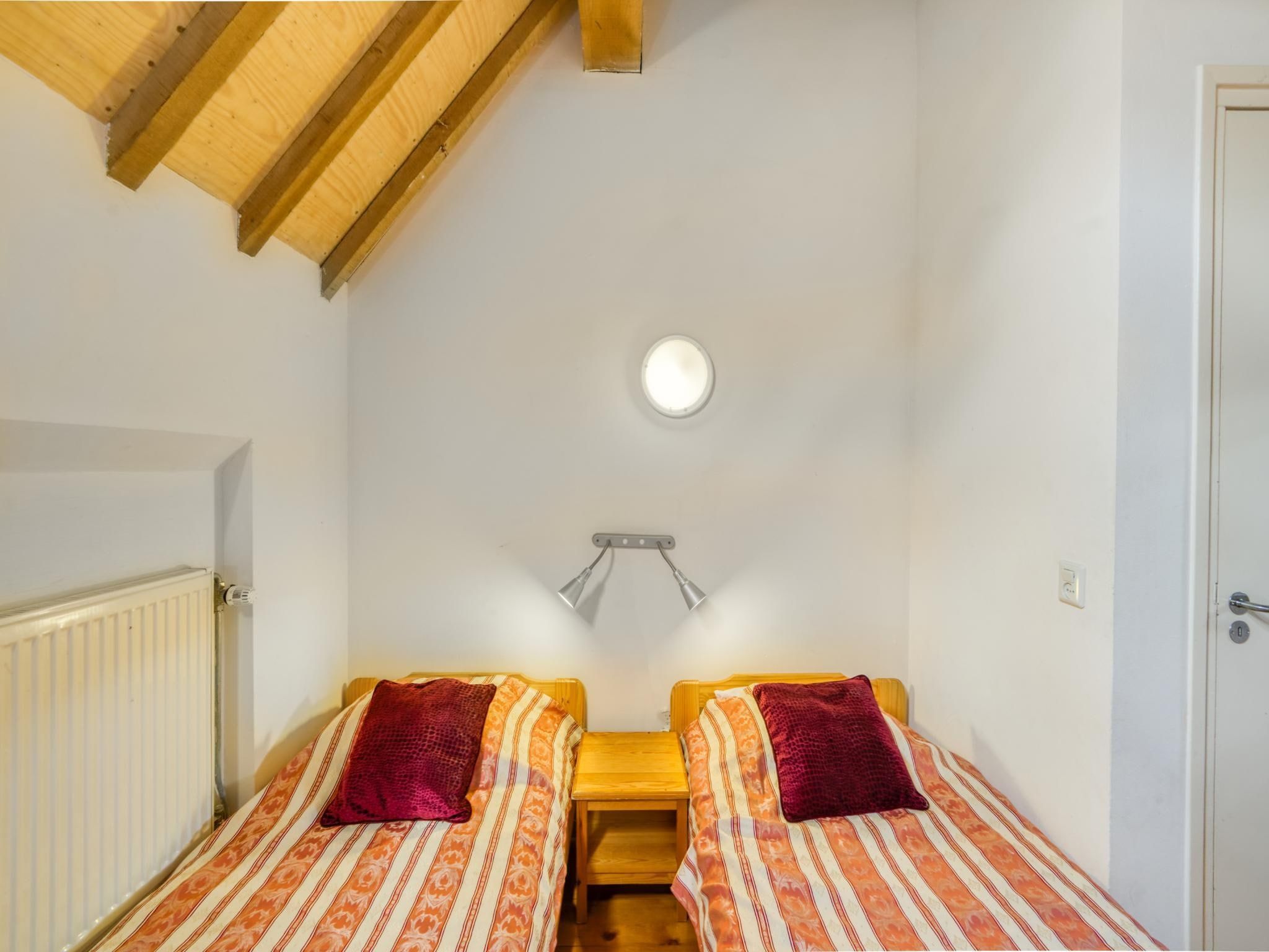 Een slaapkamer van Meschermolen 6 in Mesch-Eijsden