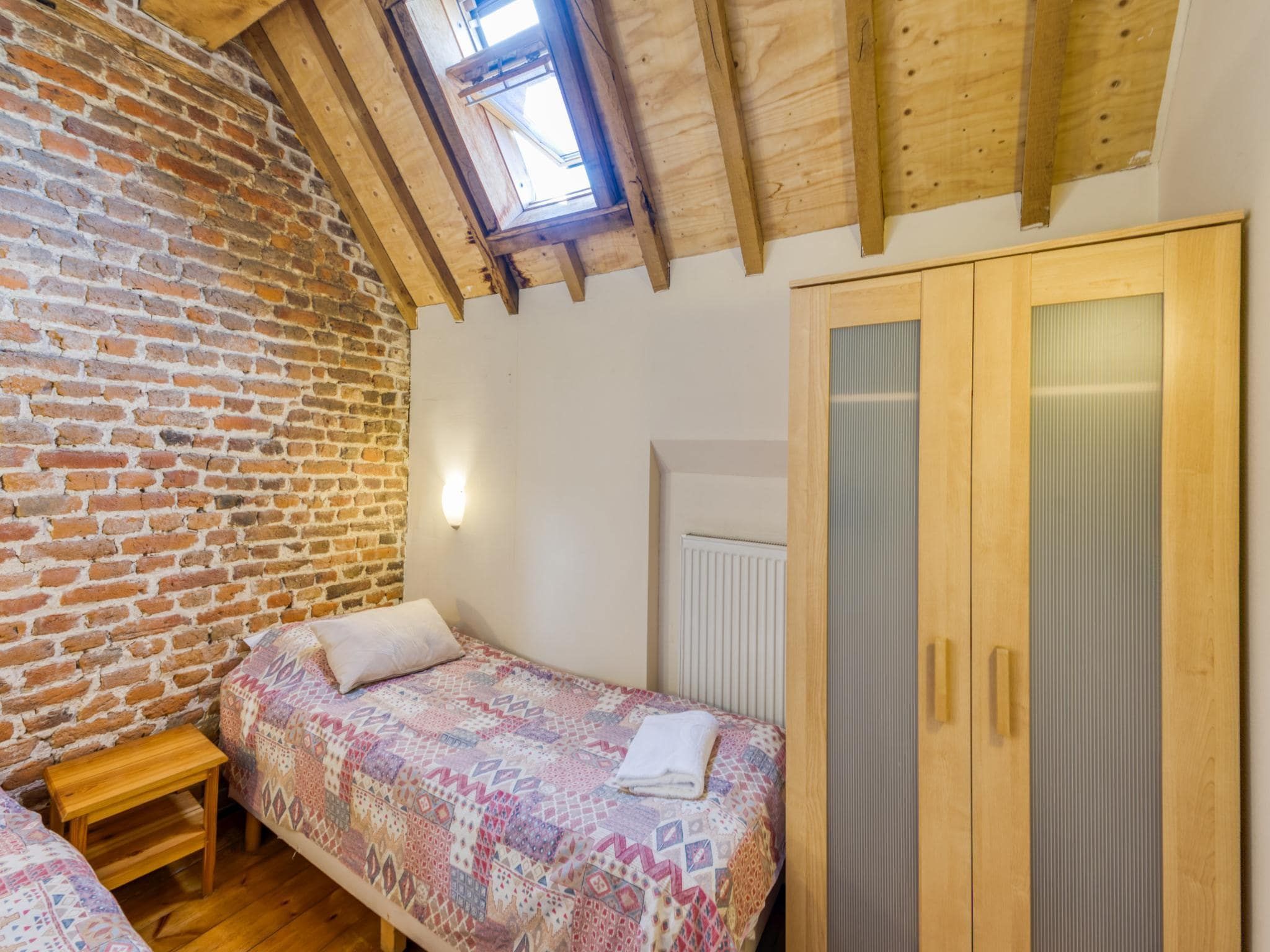 Een slaapkamer van Meschermolen 6 in Mesch-Eijsden