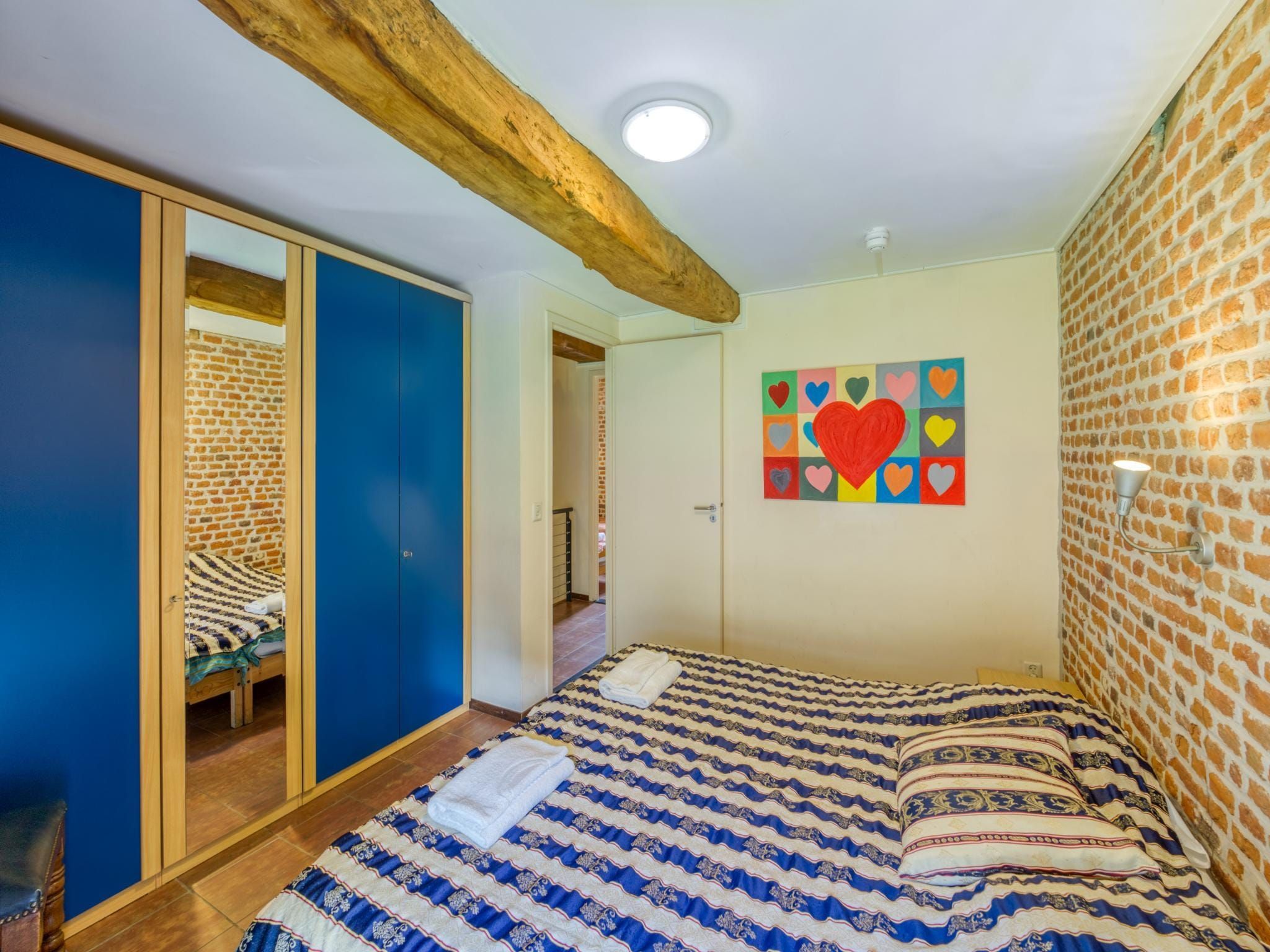 Een slaapkamer van Meschermolen 6 in Mesch-Eijsden