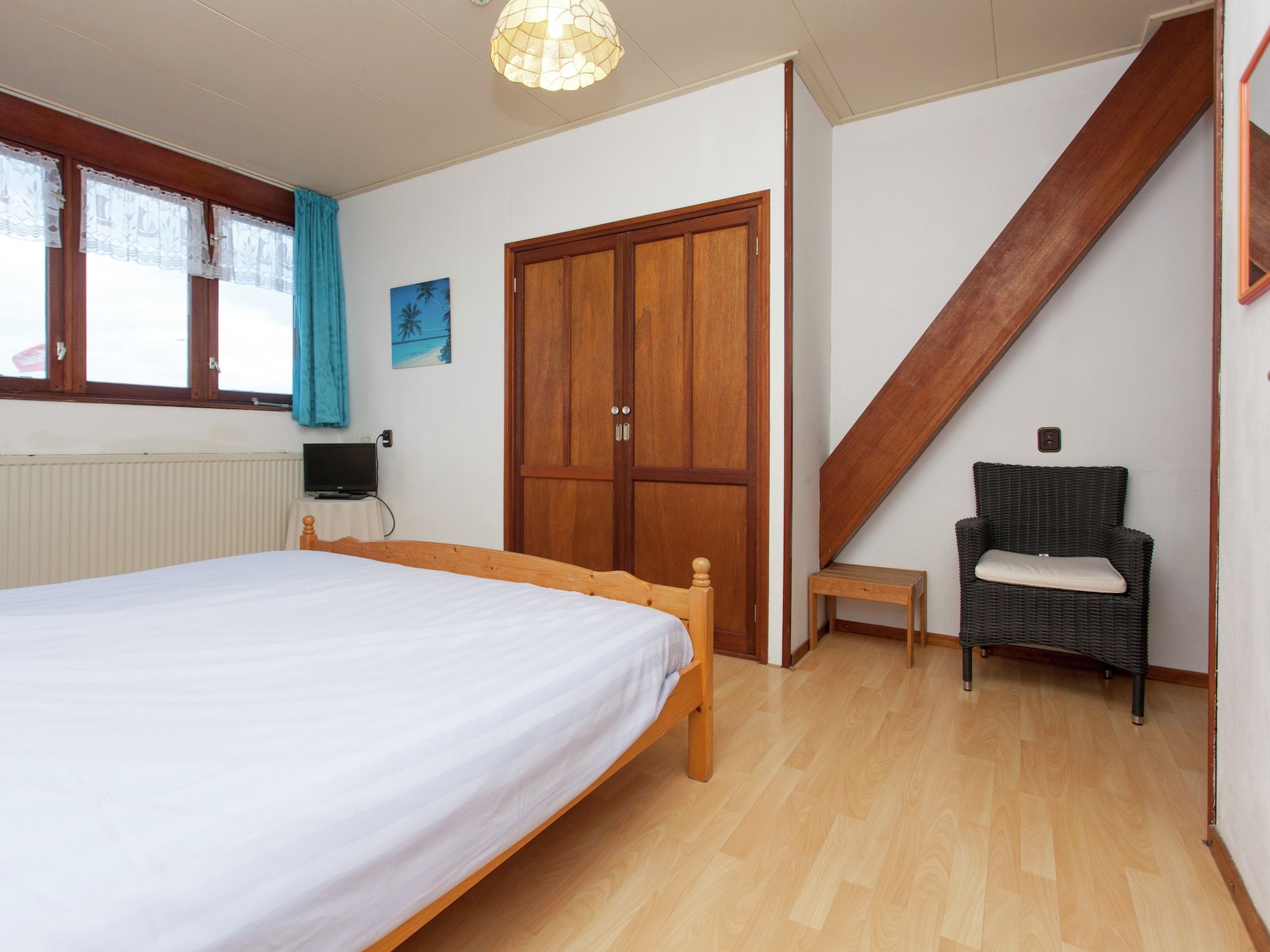 Een slaapkamer van De Vakantie boerderij in Holwerd