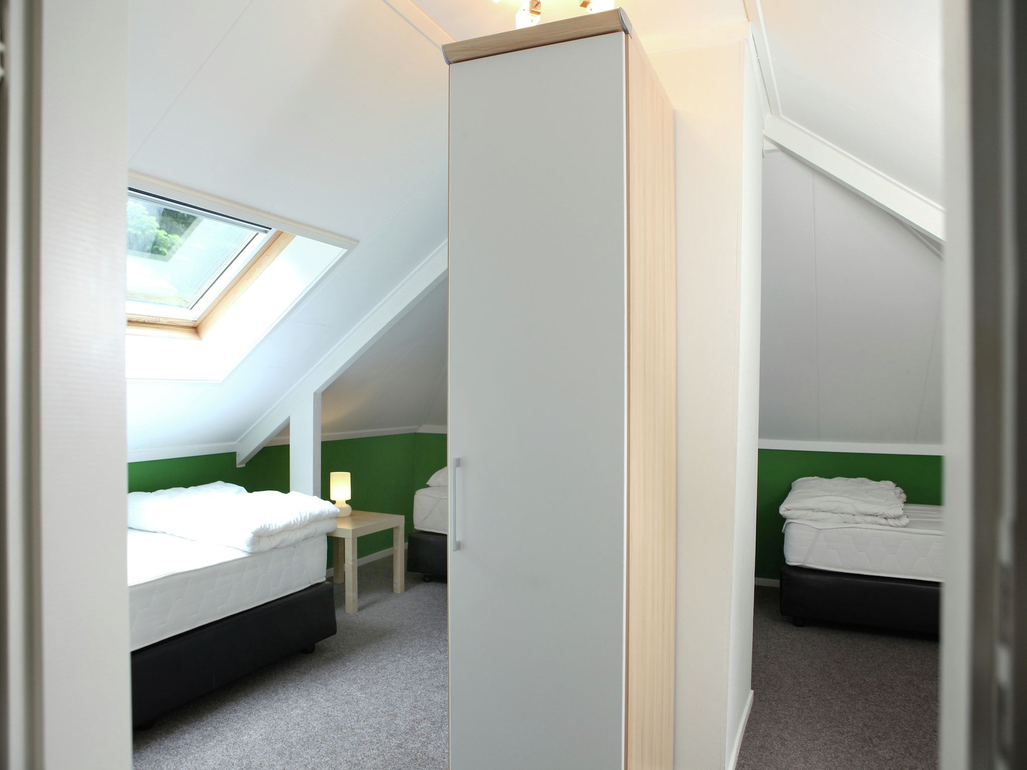 Een slaapkamer van De grove Den in Doornspijk