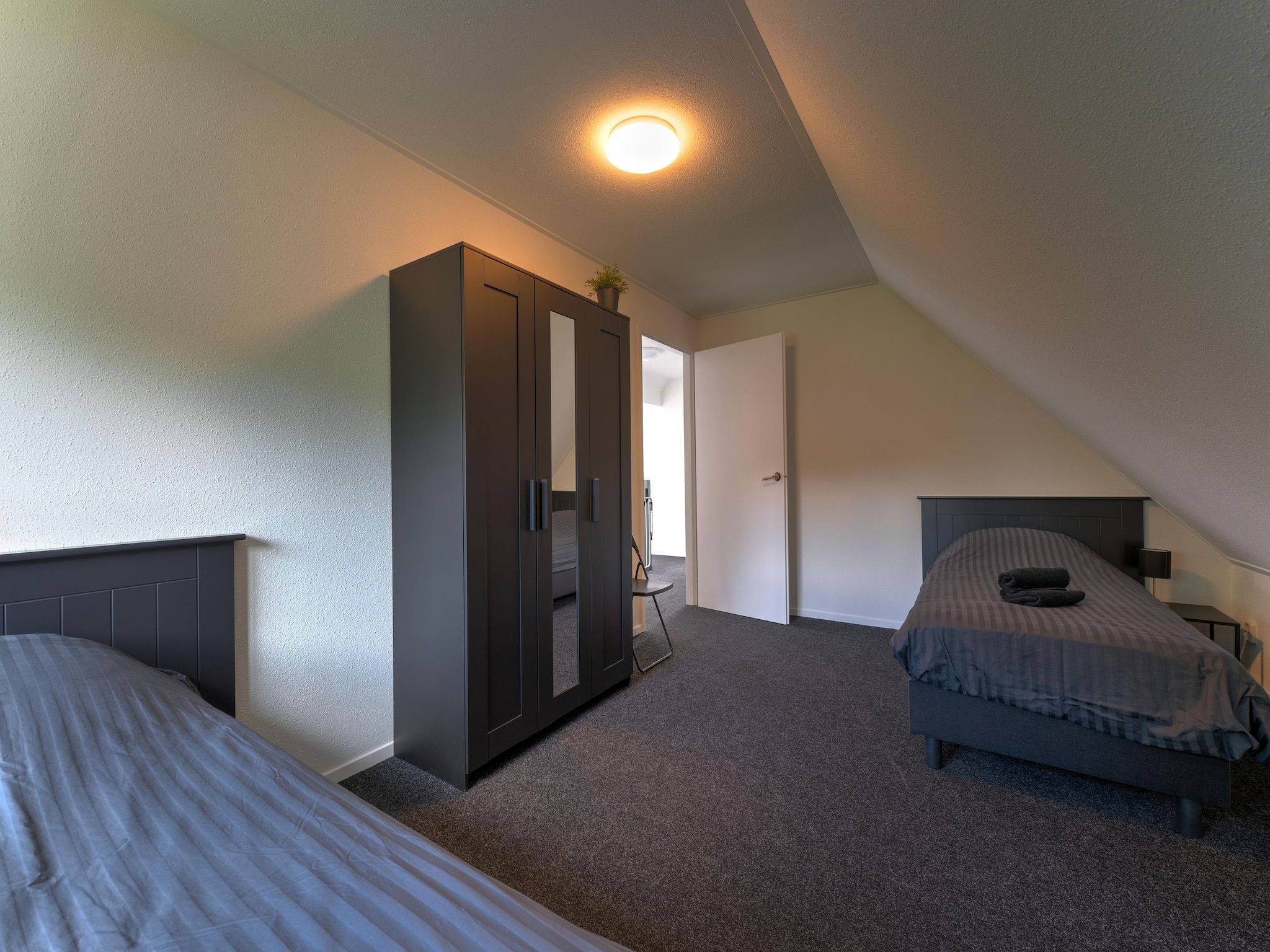 Een slaapkamer van Buitenplaats Enjoy in Zeewolde