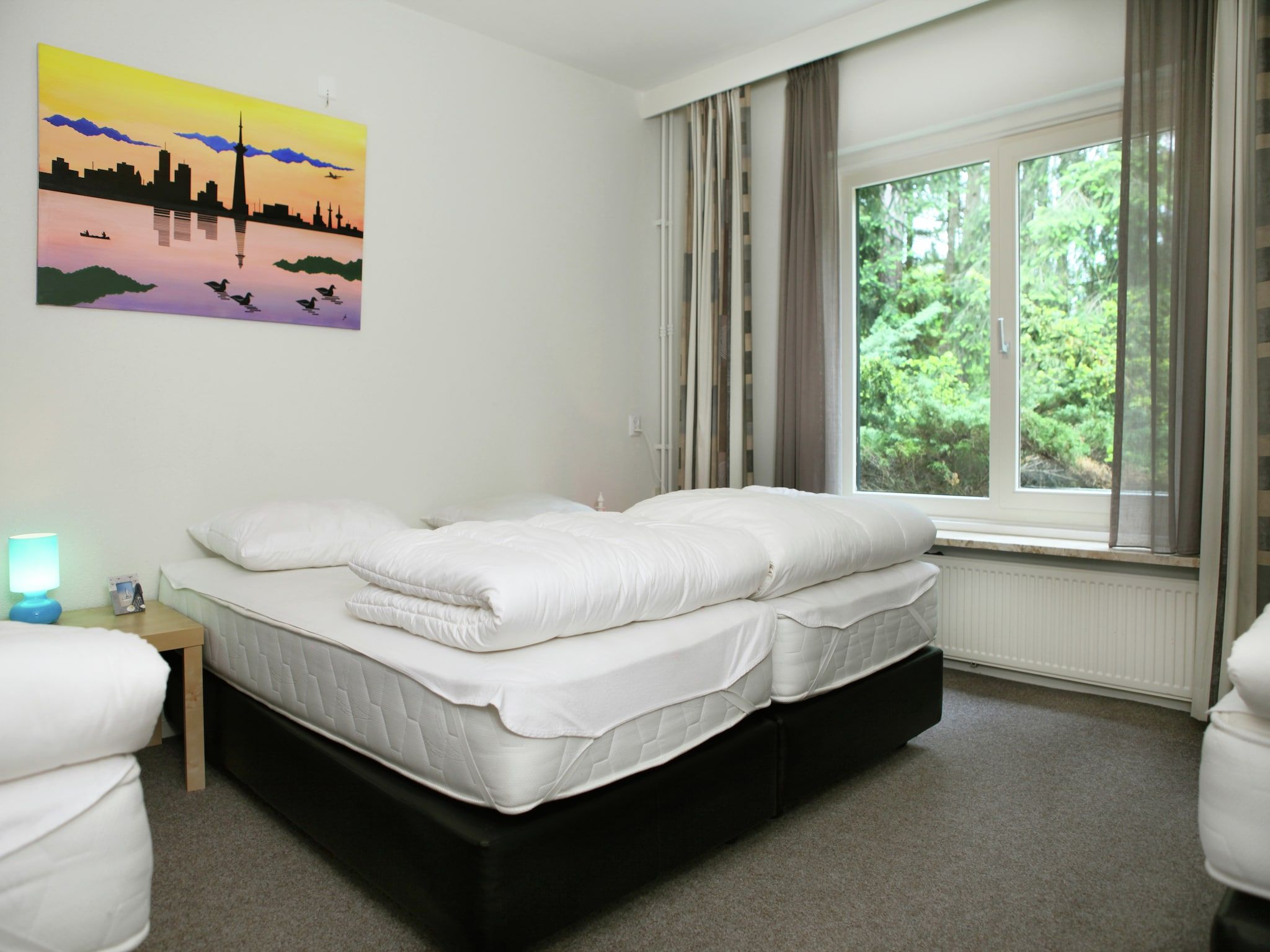 Een slaapkamer van De grove den in Doornspijk